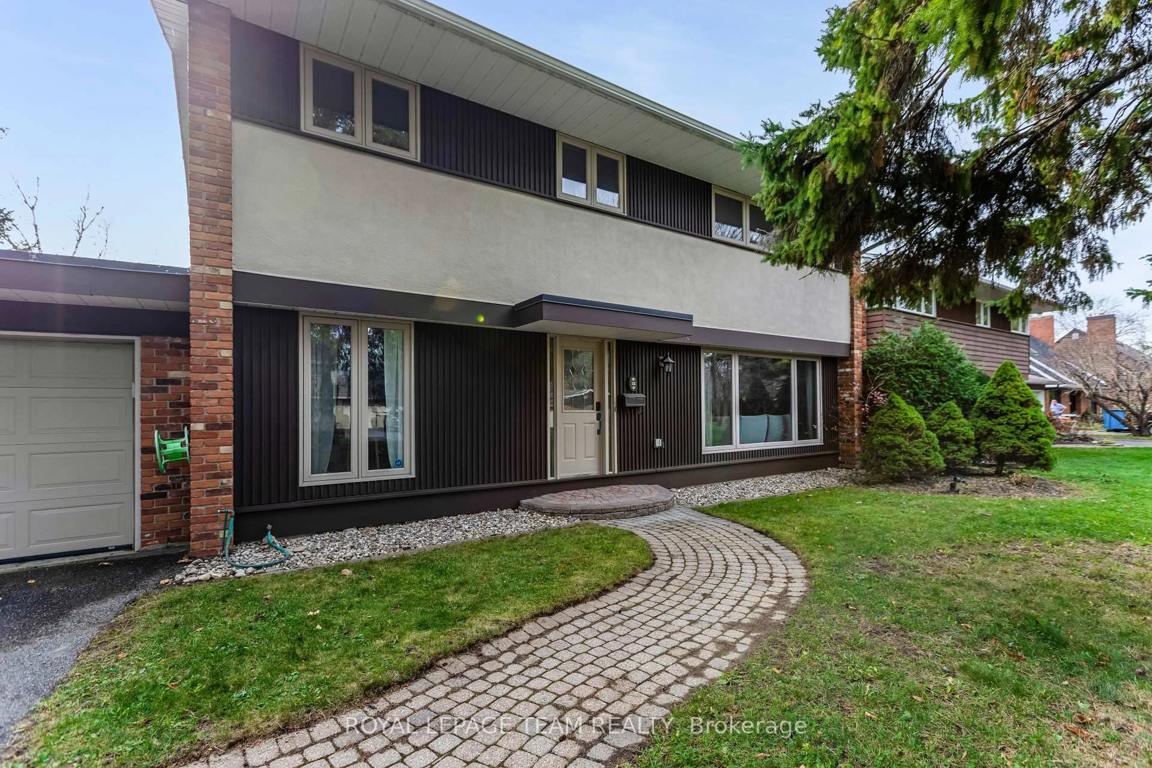 Home with brick exterior material, street for 12 Pellan Cres, Ottawa Ontario K2K 1J5