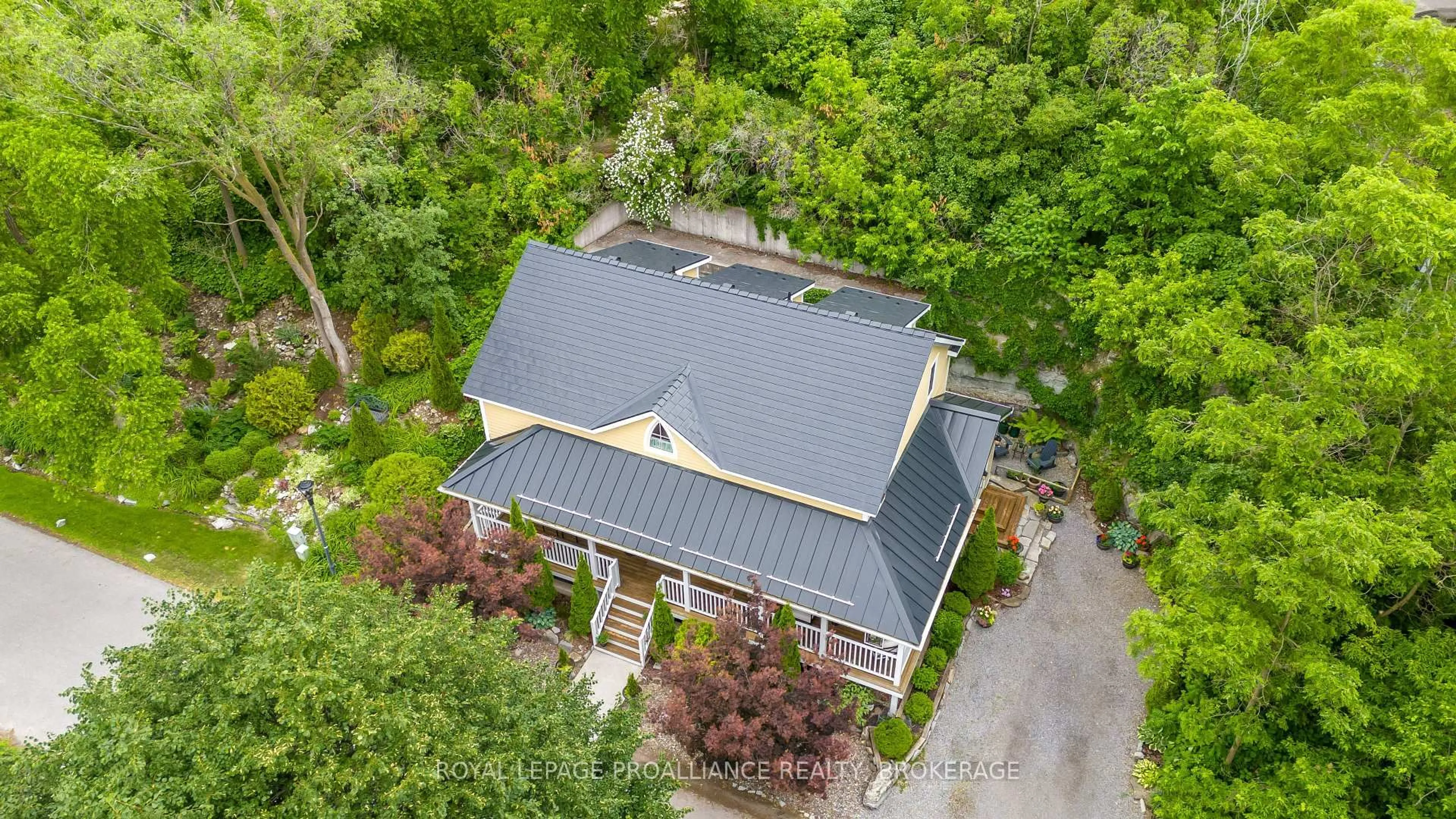 A pic from outside/outdoor area/front of a property/back of a property/a pic from drone, street for 222 Green Bay Rd, Kingston Ontario K7K 7C4