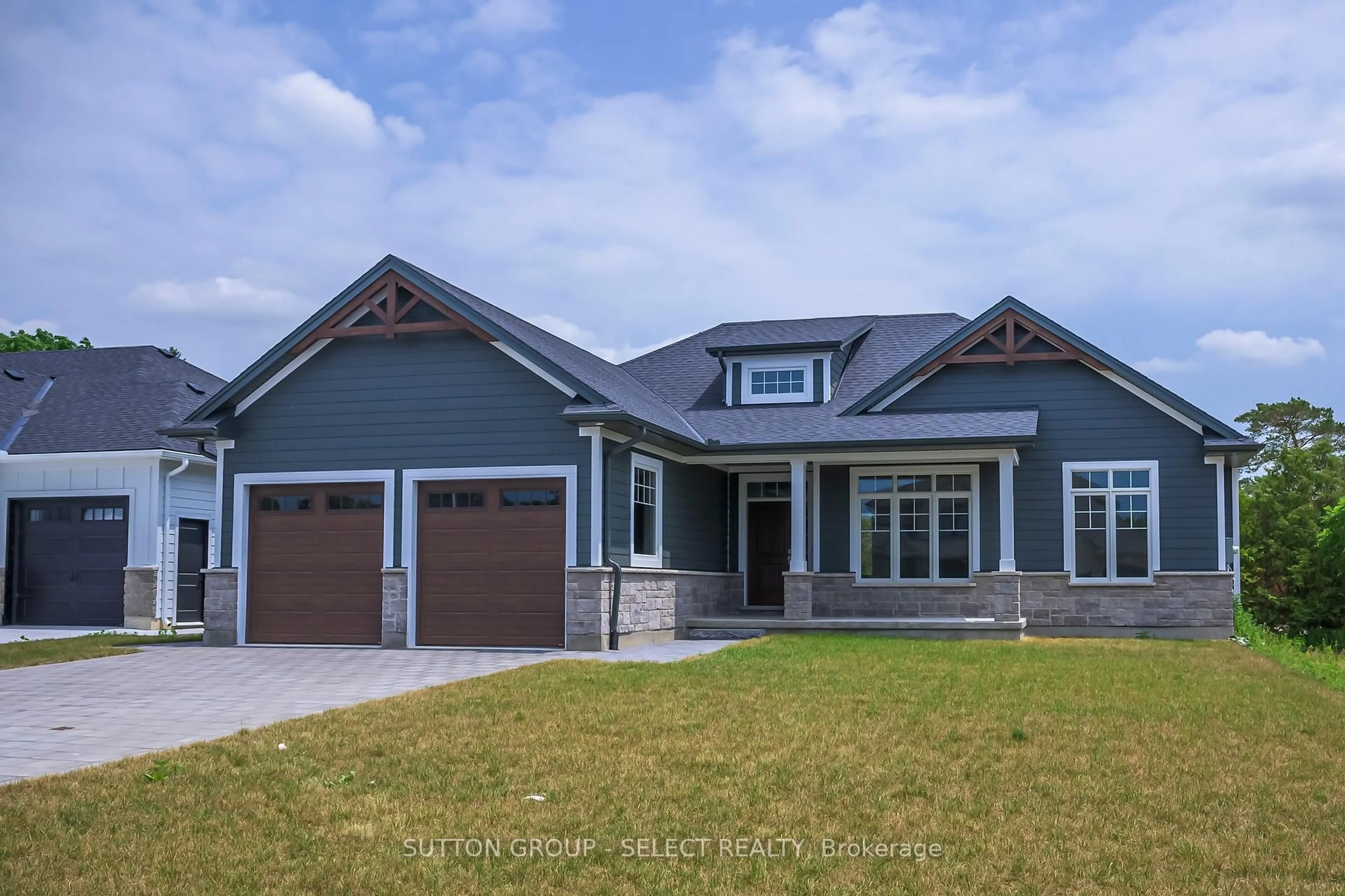 Home with vinyl exterior material, street for 7 Spruce Cres, North Middlesex Ontario N0M 2K0