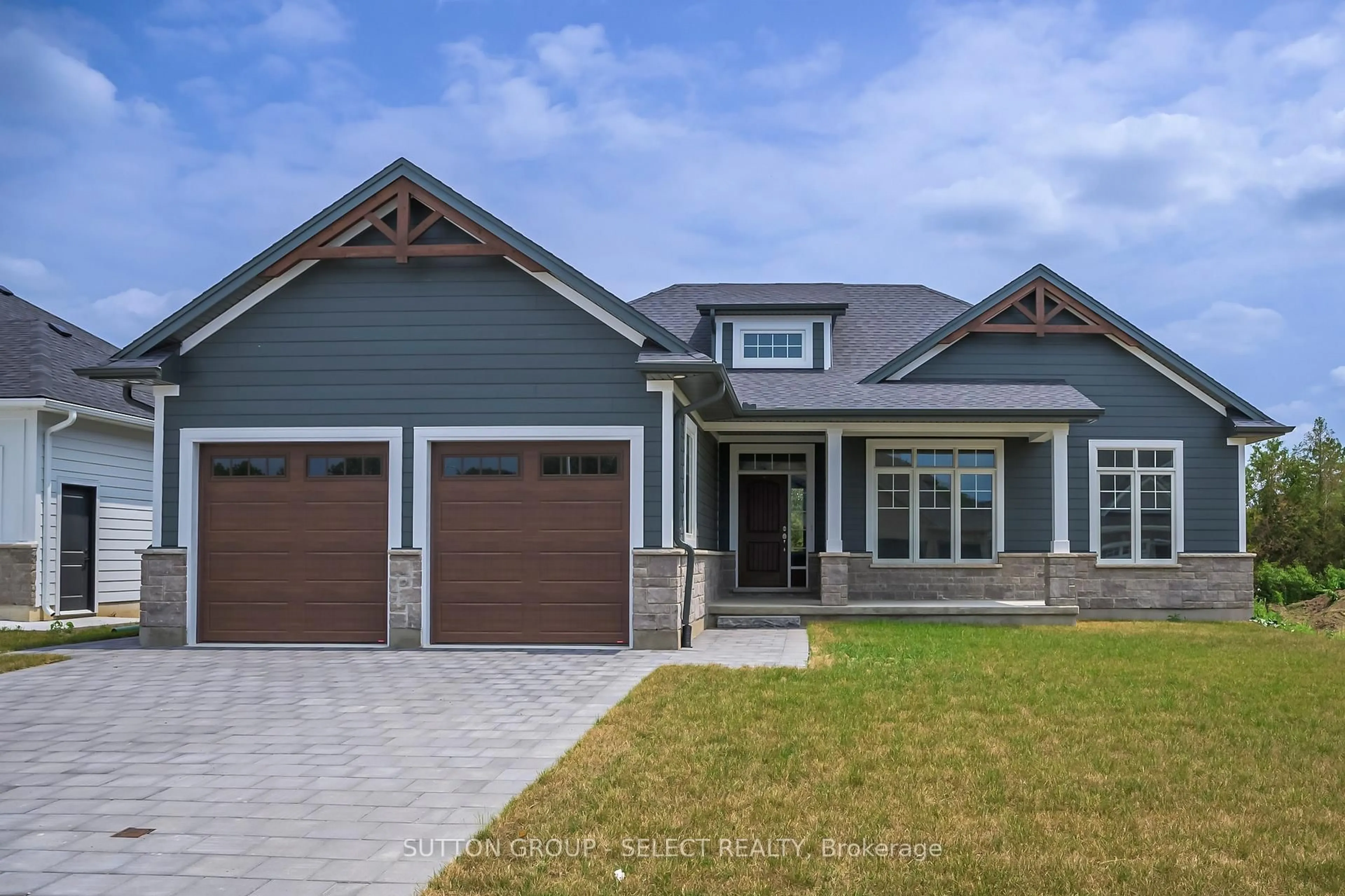 Home with vinyl exterior material, street for 7 Spruce Cres, North Middlesex Ontario N0M 2K0