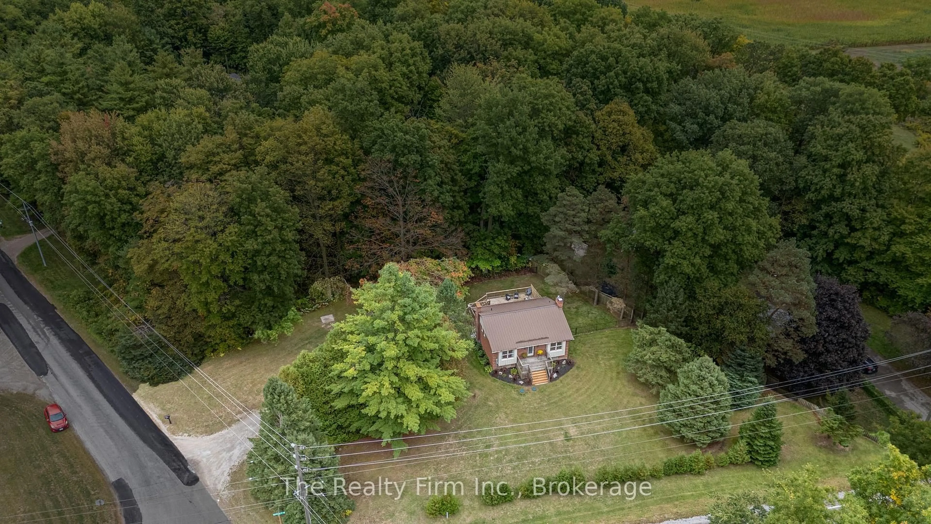 A pic from outside/outdoor area/front of a property/back of a property/a pic from drone, forest/trees view for 4 Rokeby Rd, Norfolk Ontario N4G 4G7