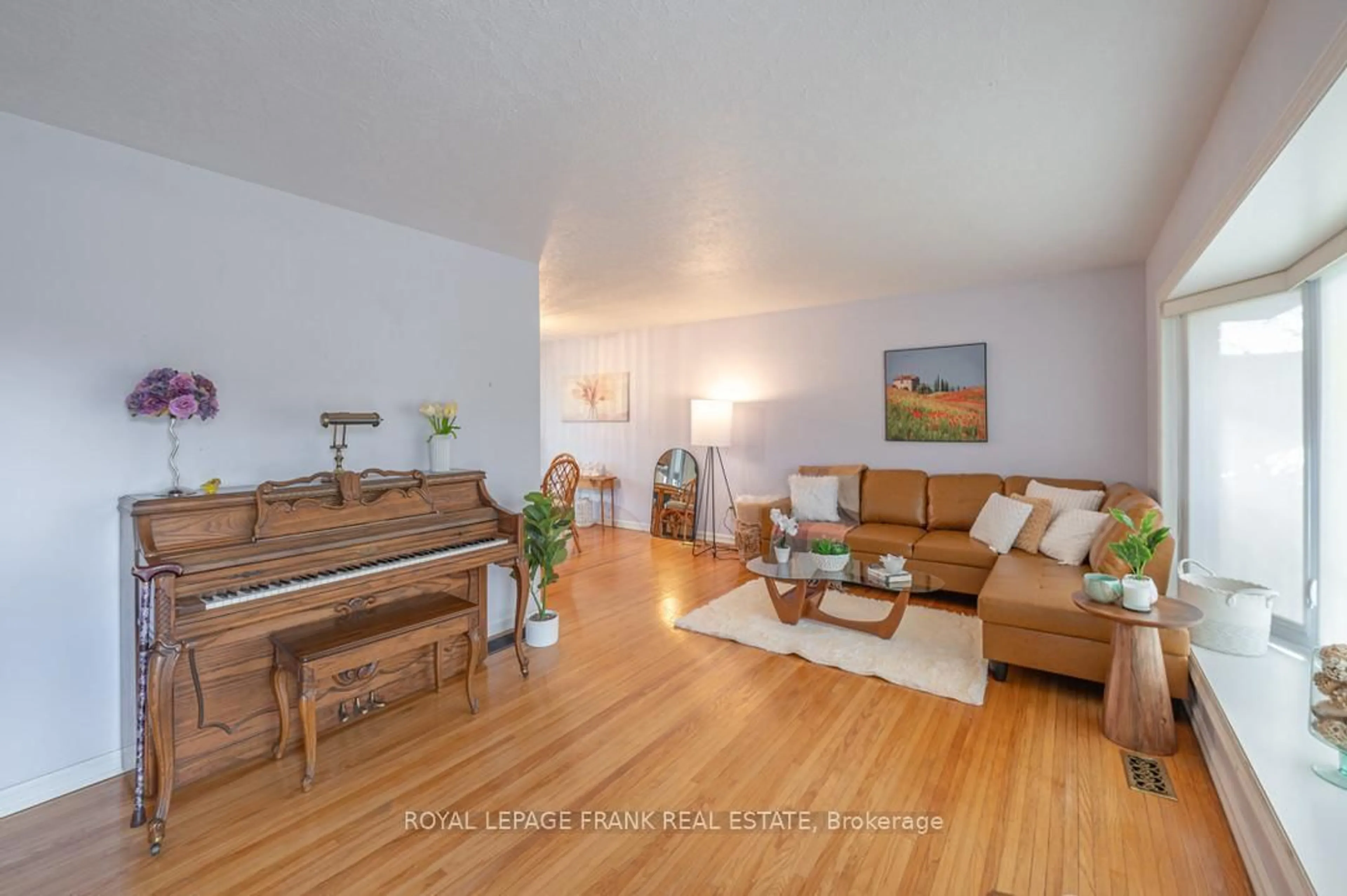 Living room with furniture, wood/laminate floor for 872 Western Ave, Peterborough Ontario K9J 5V9
