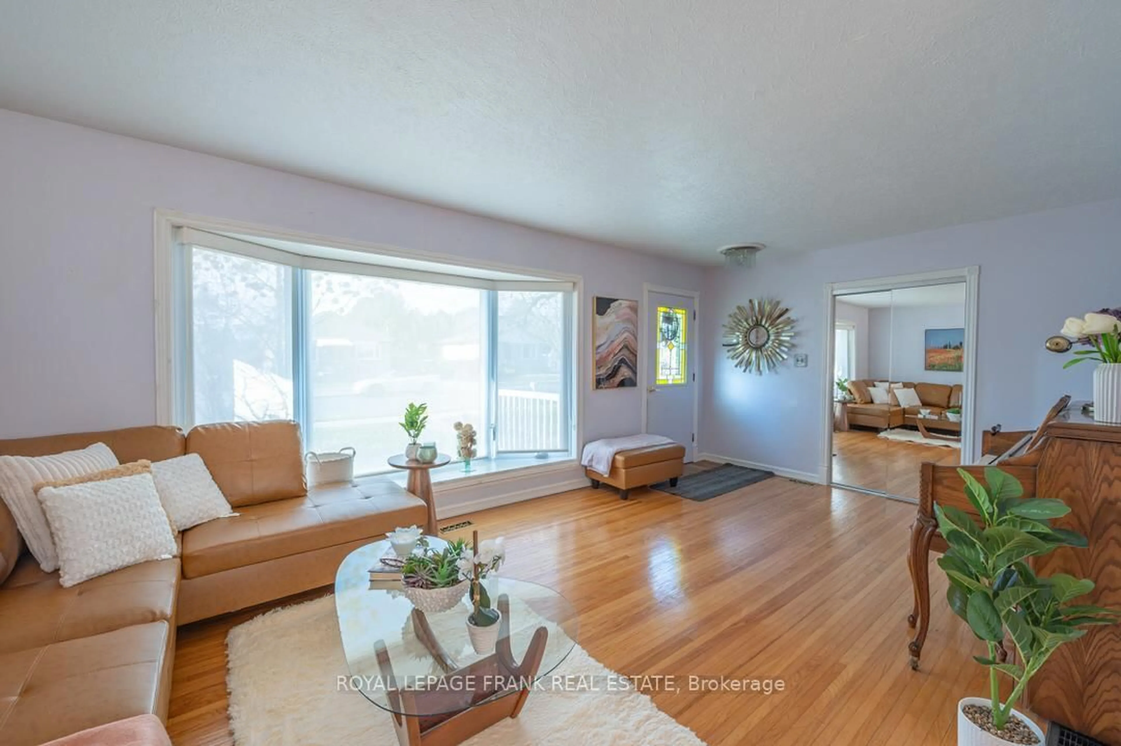 Living room with furniture, wood/laminate floor for 872 Western Ave, Peterborough Ontario K9J 5V9