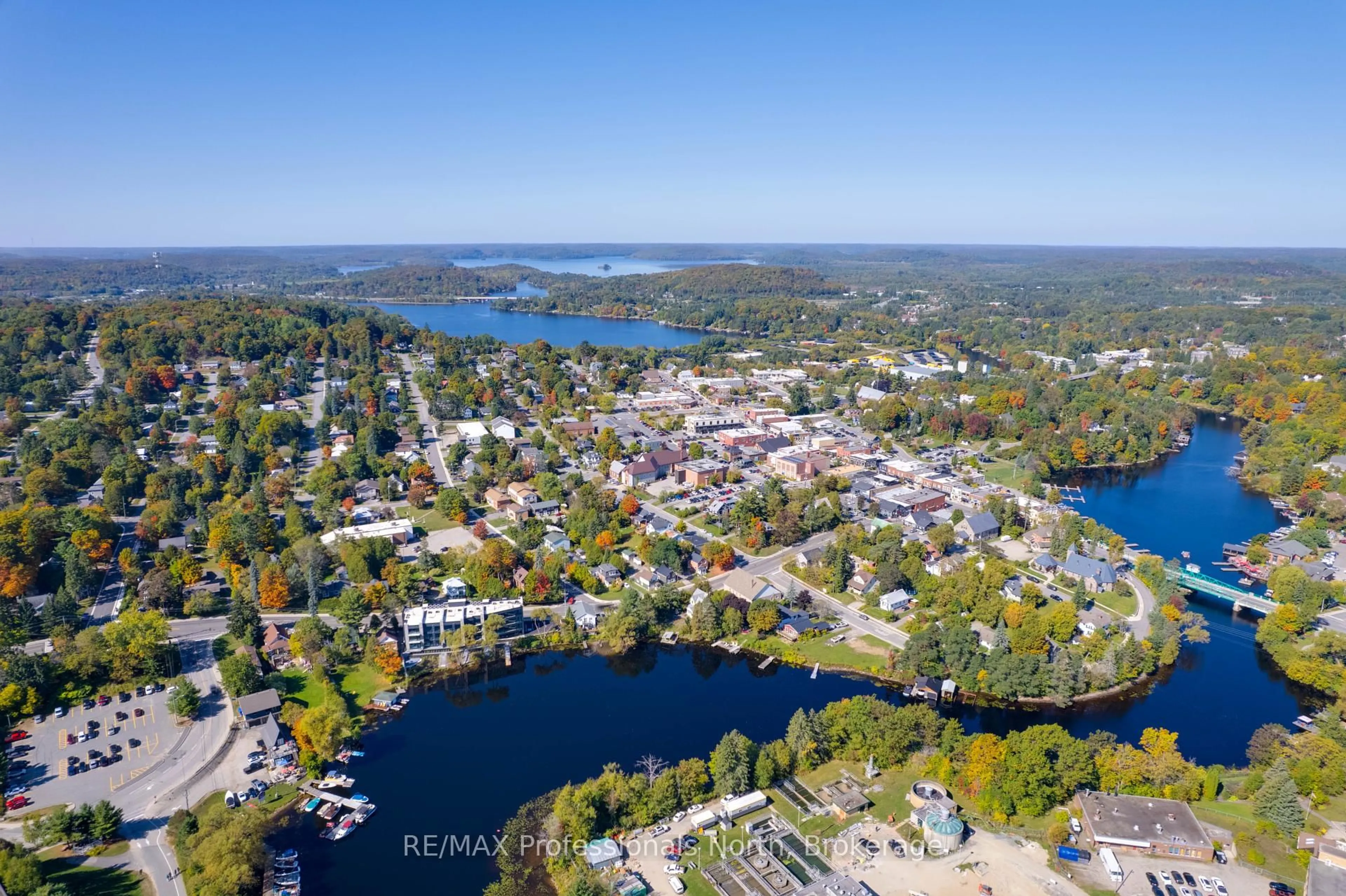 A pic from outside/outdoor area/front of a property/back of a property/a pic from drone, water/lake/river/ocean view for 32 Brunel Rd #105, Huntsville Ontario P1H 1P5