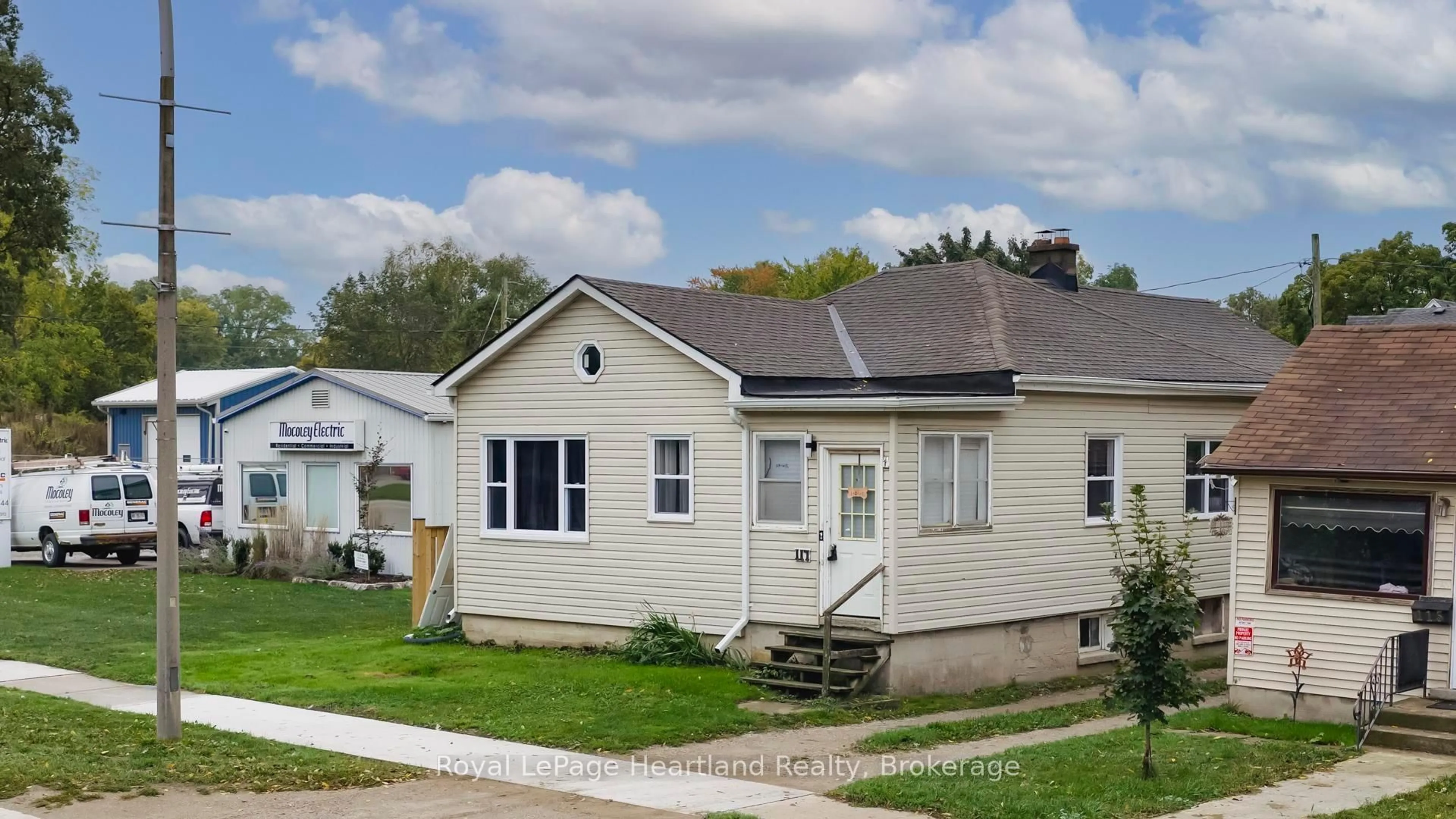 Home with vinyl exterior material, street for 117 MAIN St, North Middlesex Ontario N0M 1A0