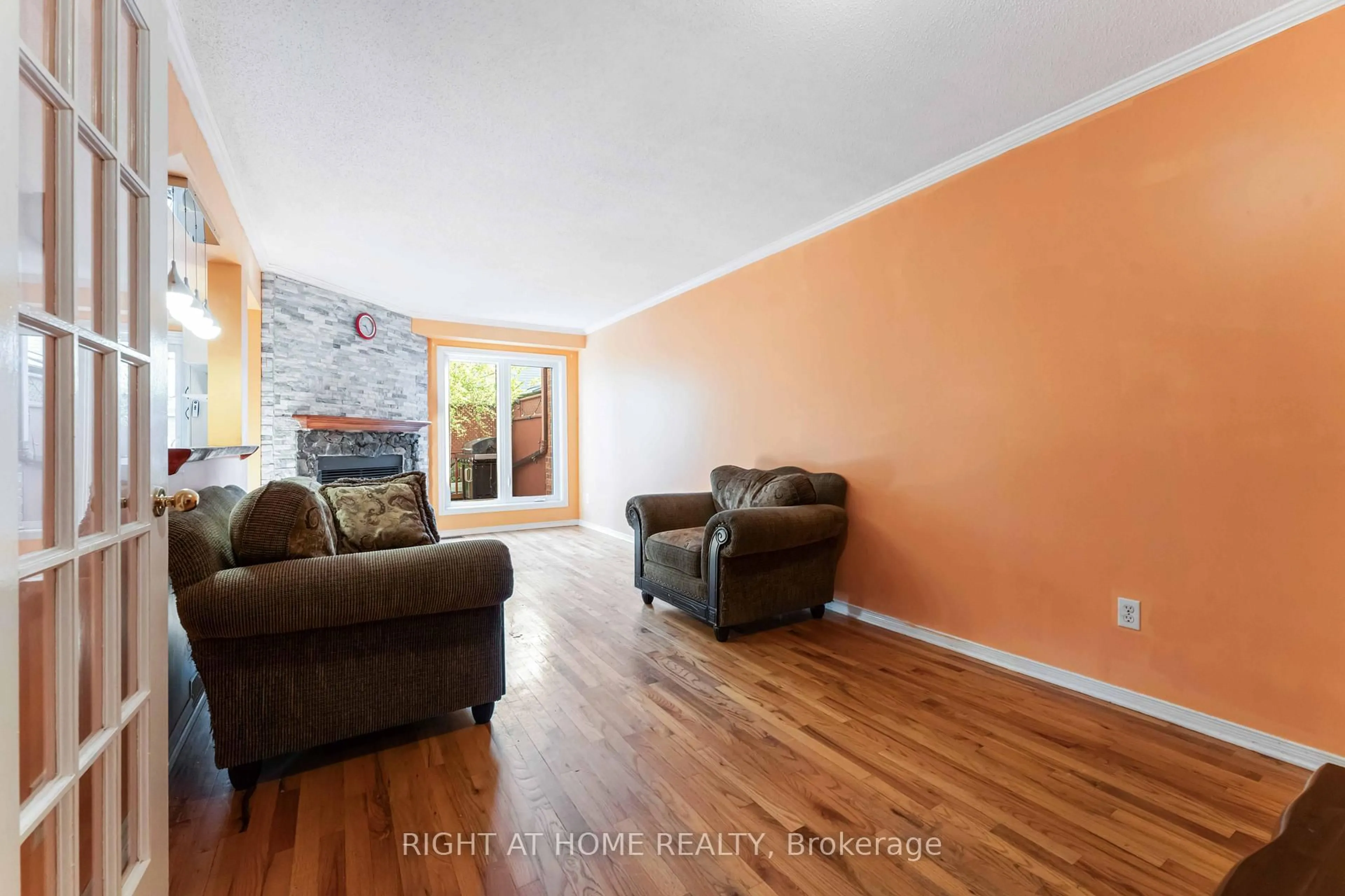 Living room with furniture, wood/laminate floor for 5 Harrington Crt, Ottawa Ontario K2K 2S7