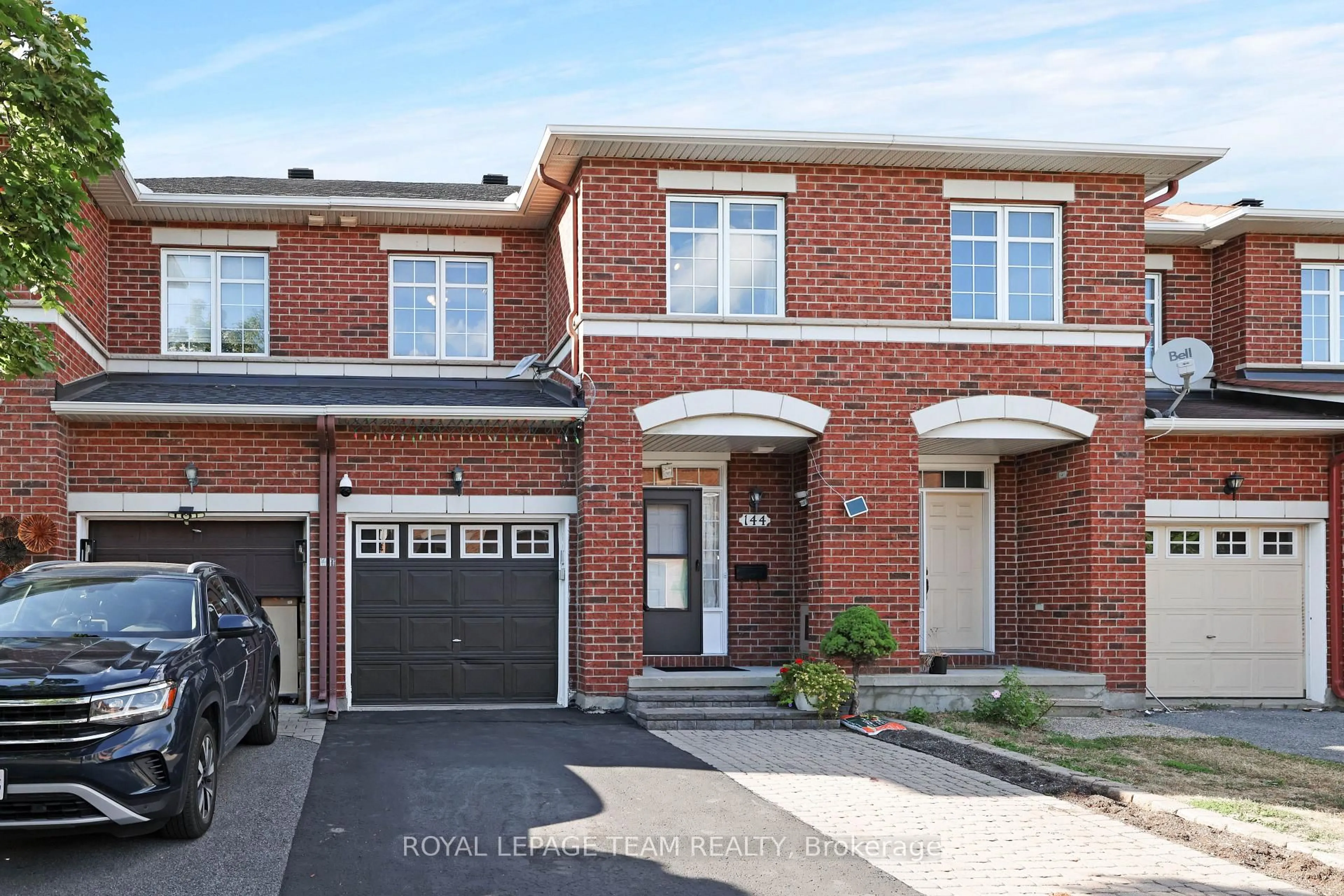 Home with brick exterior material, street for 144 Deercroft Ave, Ottawa Ontario K2J 5H9
