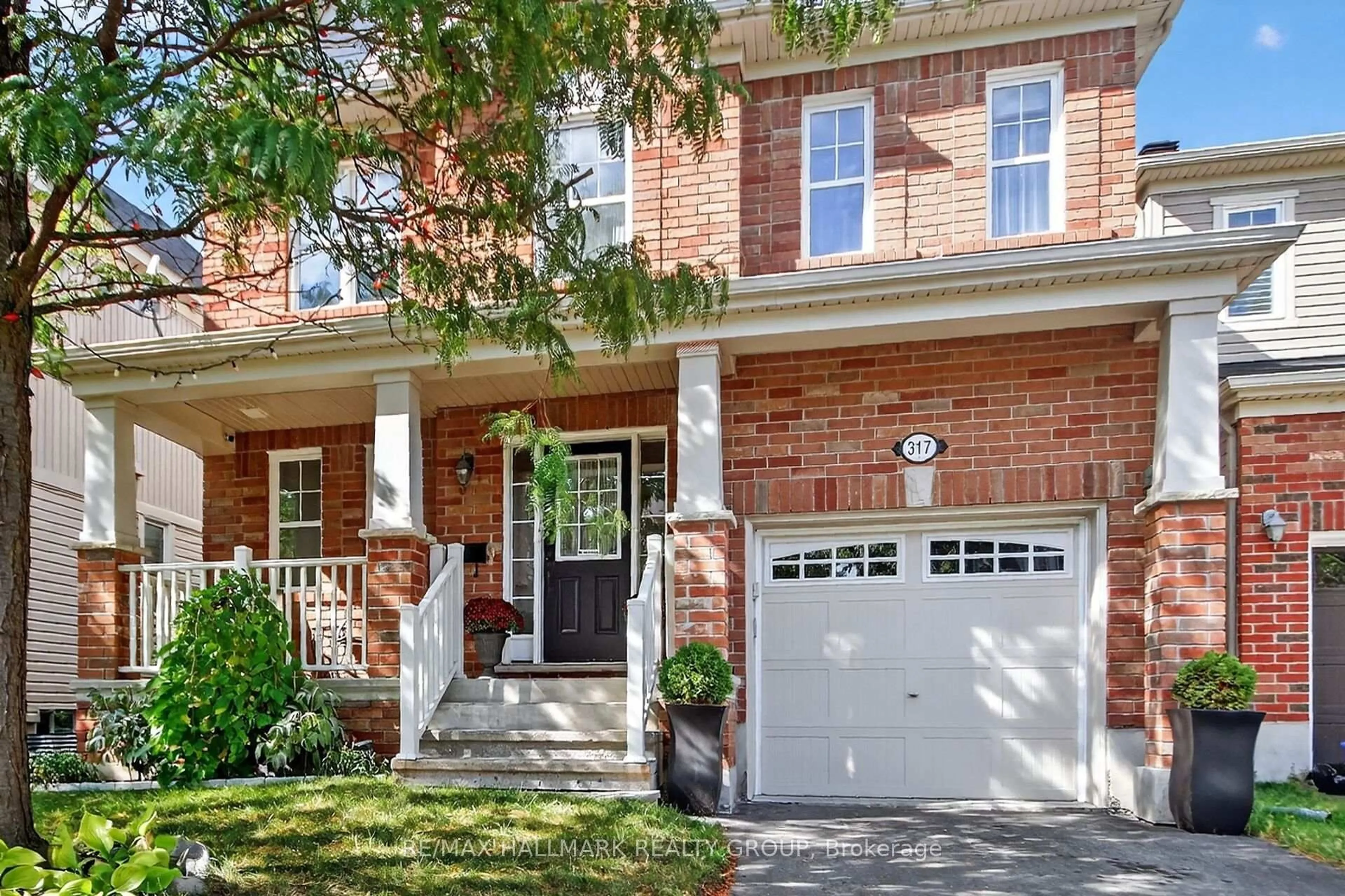 Home with brick exterior material, street for 317 River Landing Ave, Ottawa Ontario K2J 3V4