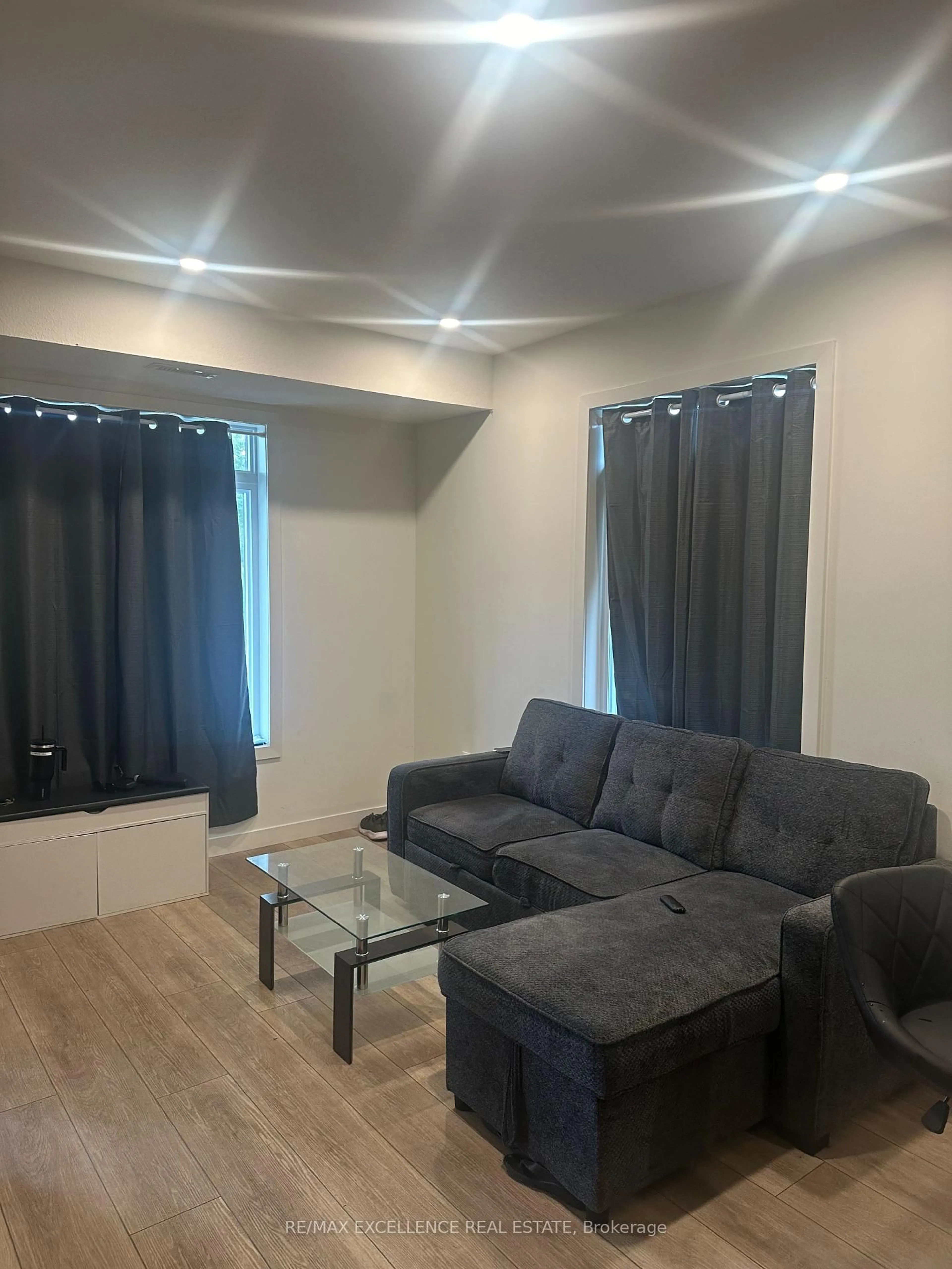 Living room with furniture, wood/laminate floor for 405 Myers Rd #2, Cambridge Ontario N1P 0B6