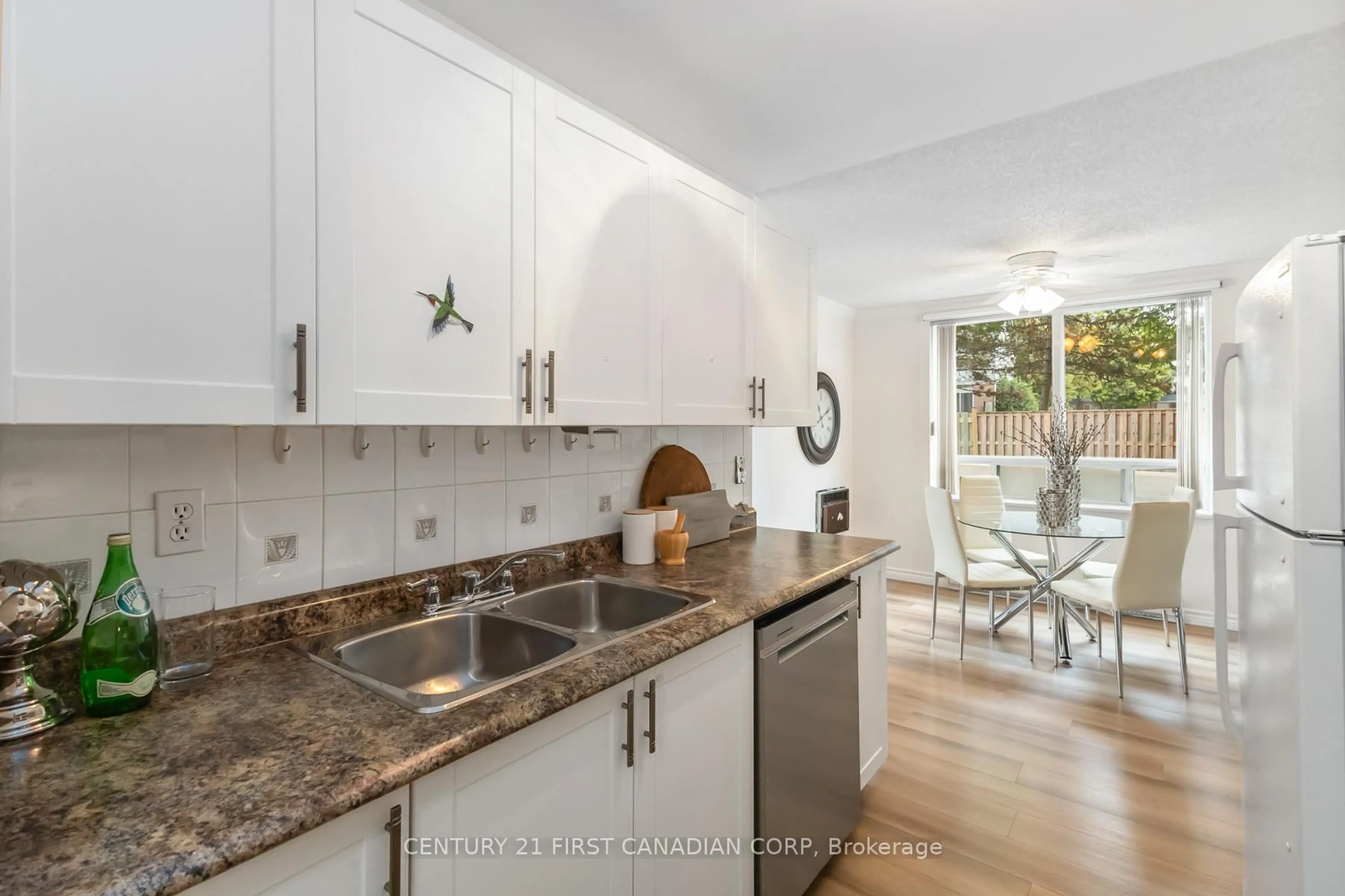 Open concept kitchen, ceramic/tile floor for 76 Base Line Rd #108, London South Ontario N6J 4X6