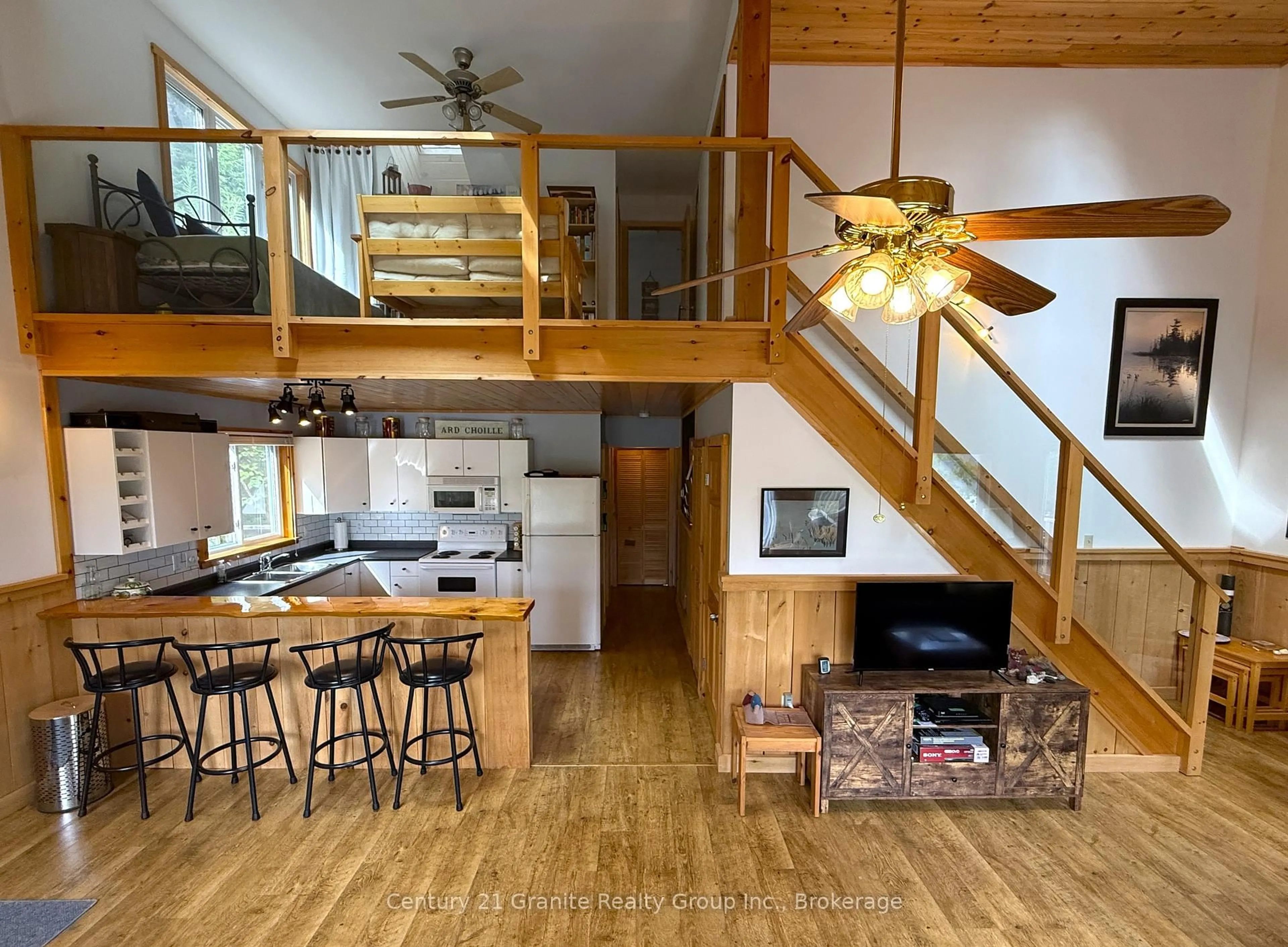 Open concept kitchen, wood/laminate floor for 1773 Blue Heron Rd, Dysart et al Ontario K0M 1S0