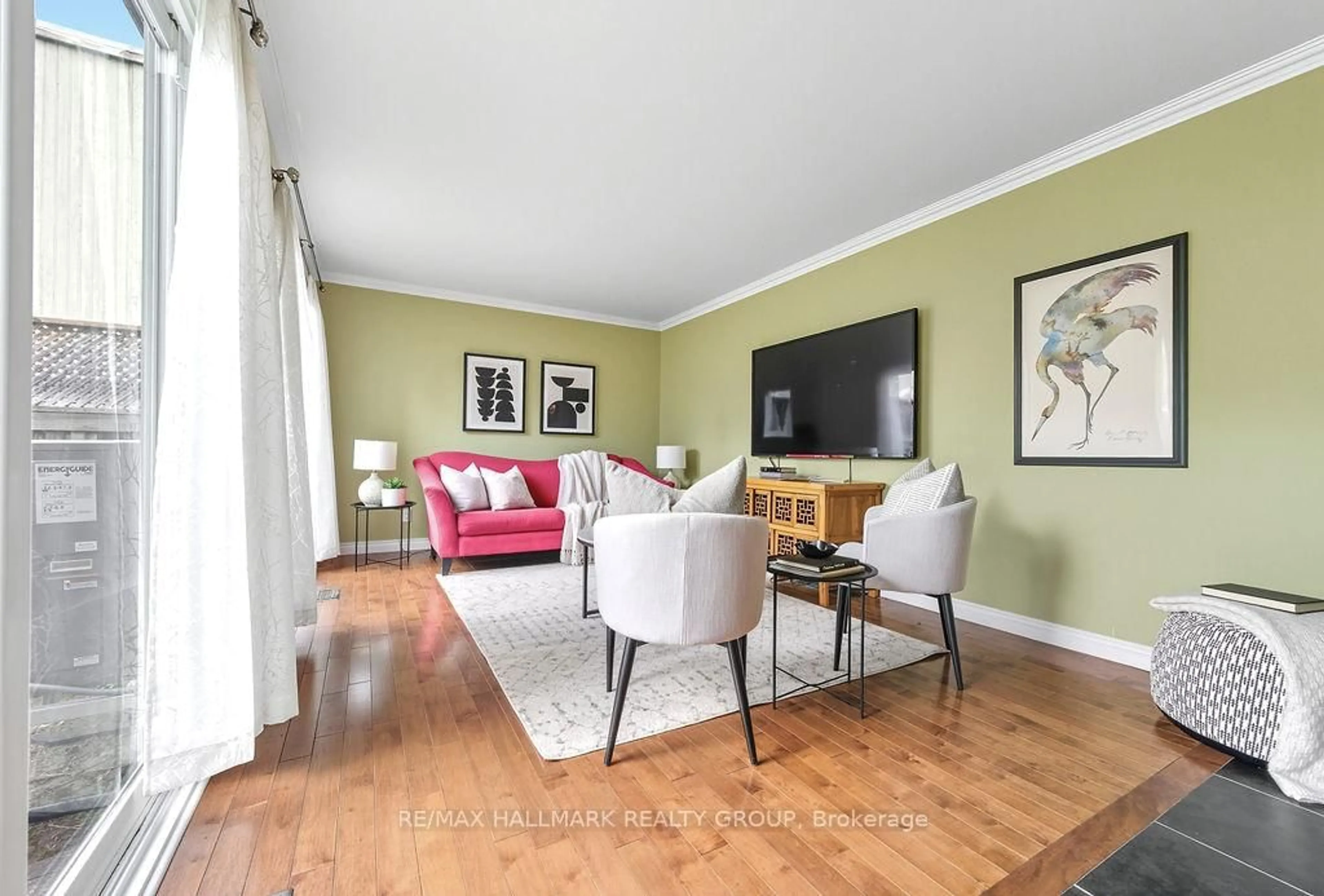 Living room with furniture, wood/laminate floor for 29D Varley Dr #D, Ottawa Ontario K2K 1G4
