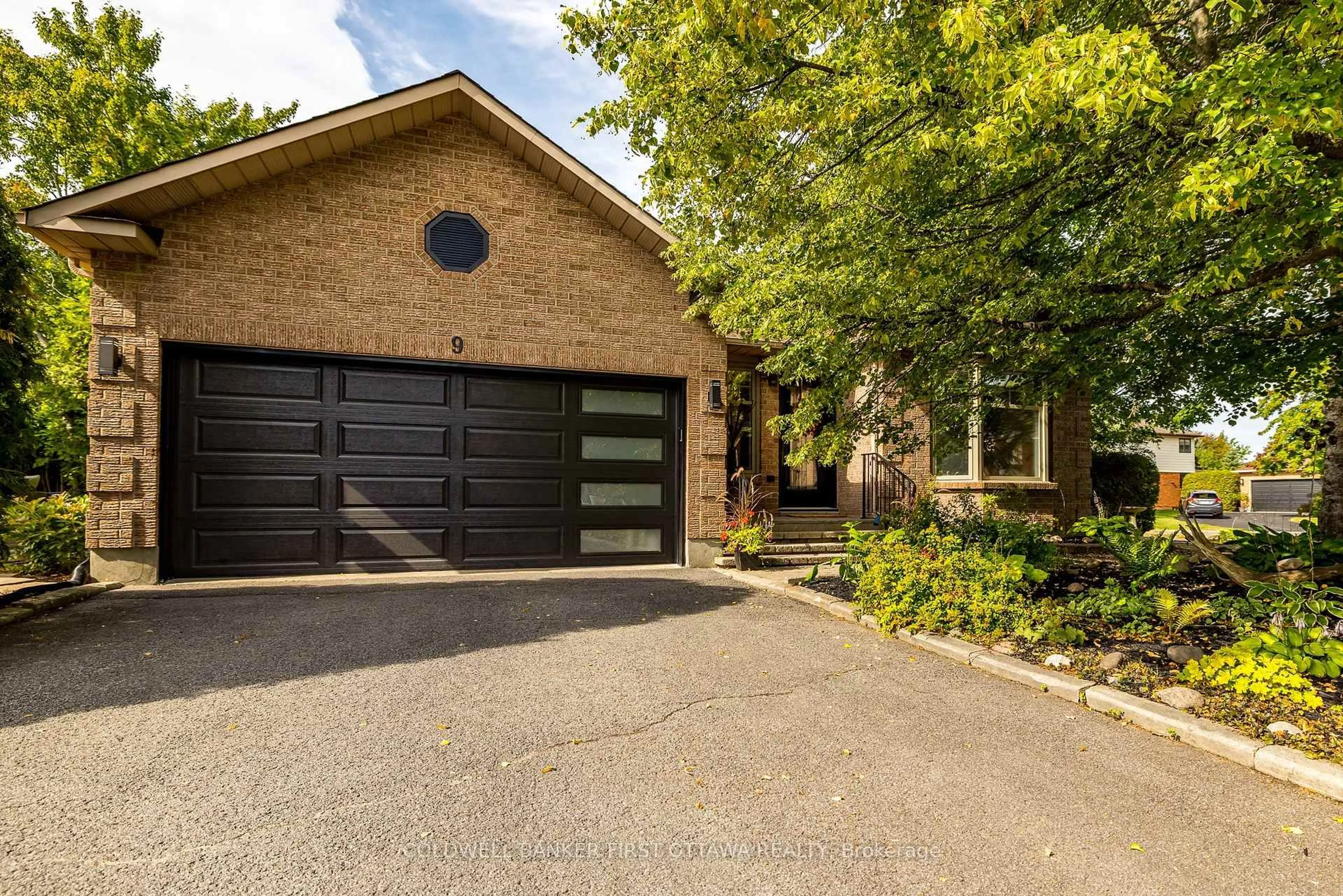 Home with brick exterior material, street for 9 Lone Meadow Tr, Ottawa Ontario K2S 1C9