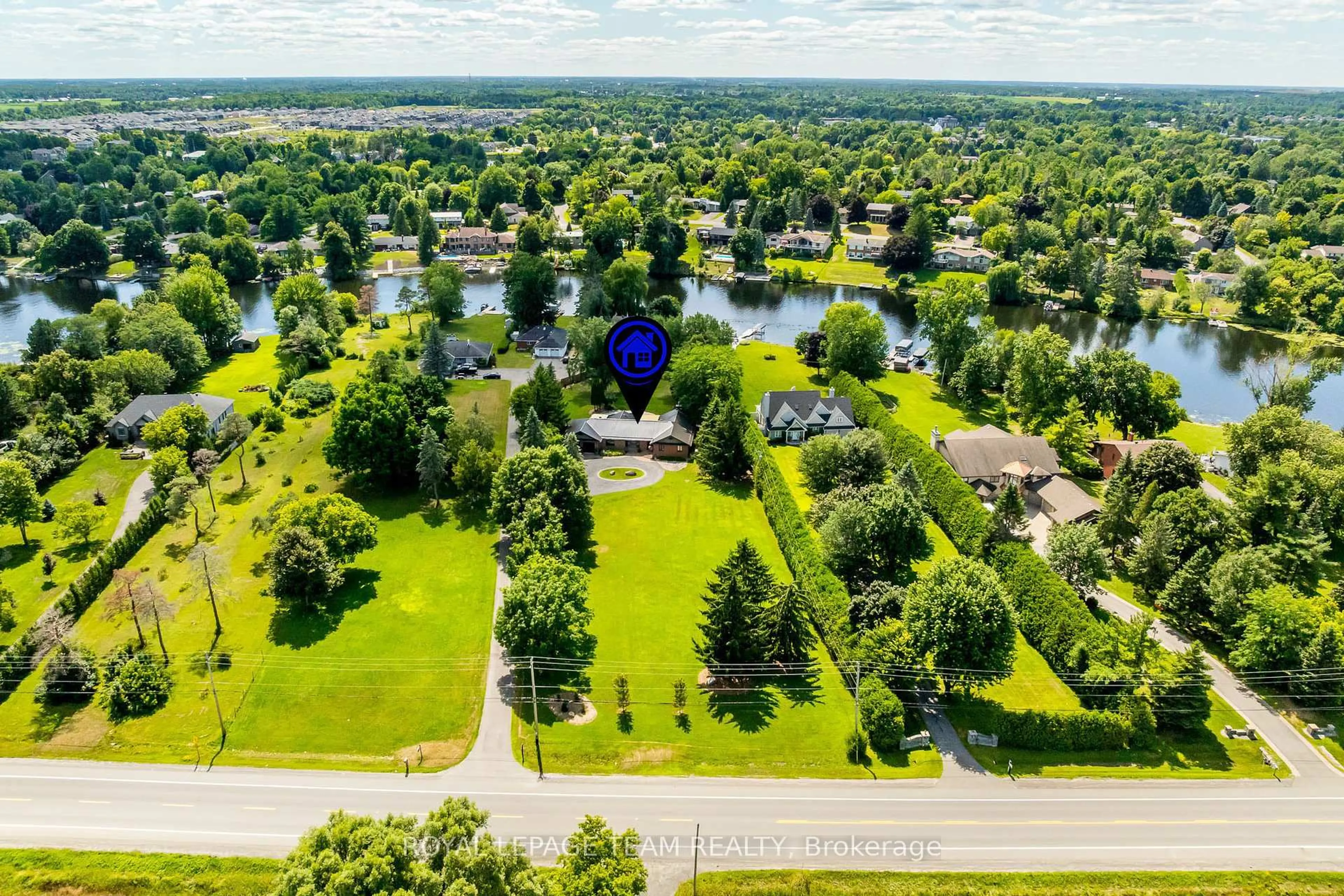A pic from outside/outdoor area/front of a property/back of a property/a pic from drone, water/lake/river/ocean view for 1216A River Rd, Ottawa Ontario K4M 1B4