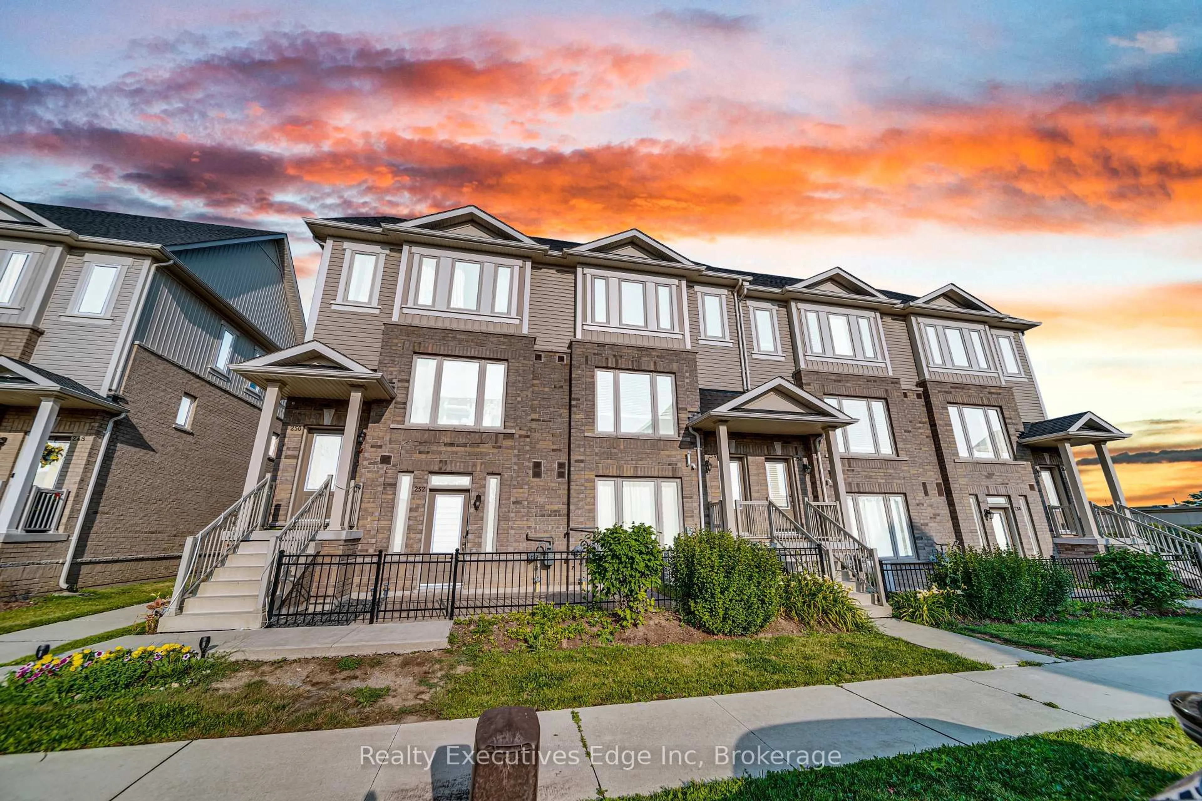 A pic from outside/outdoor area/front of a property/back of a property/a pic from drone, unknown for 252 Law Dr #65, Guelph Ontario N1E 0P6