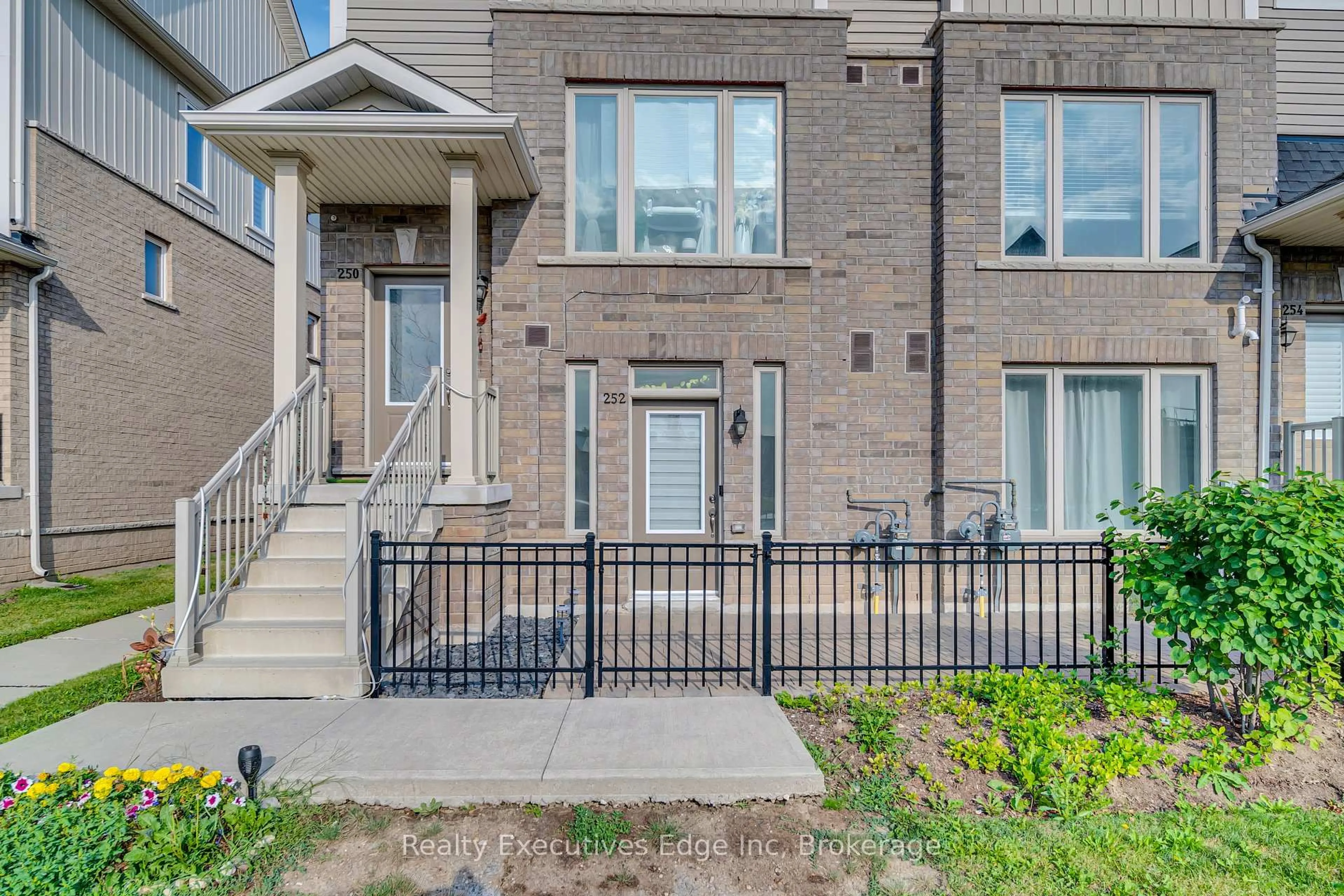 Home with brick exterior material, street for 252 Law Dr #65, Guelph Ontario N1E 0P6