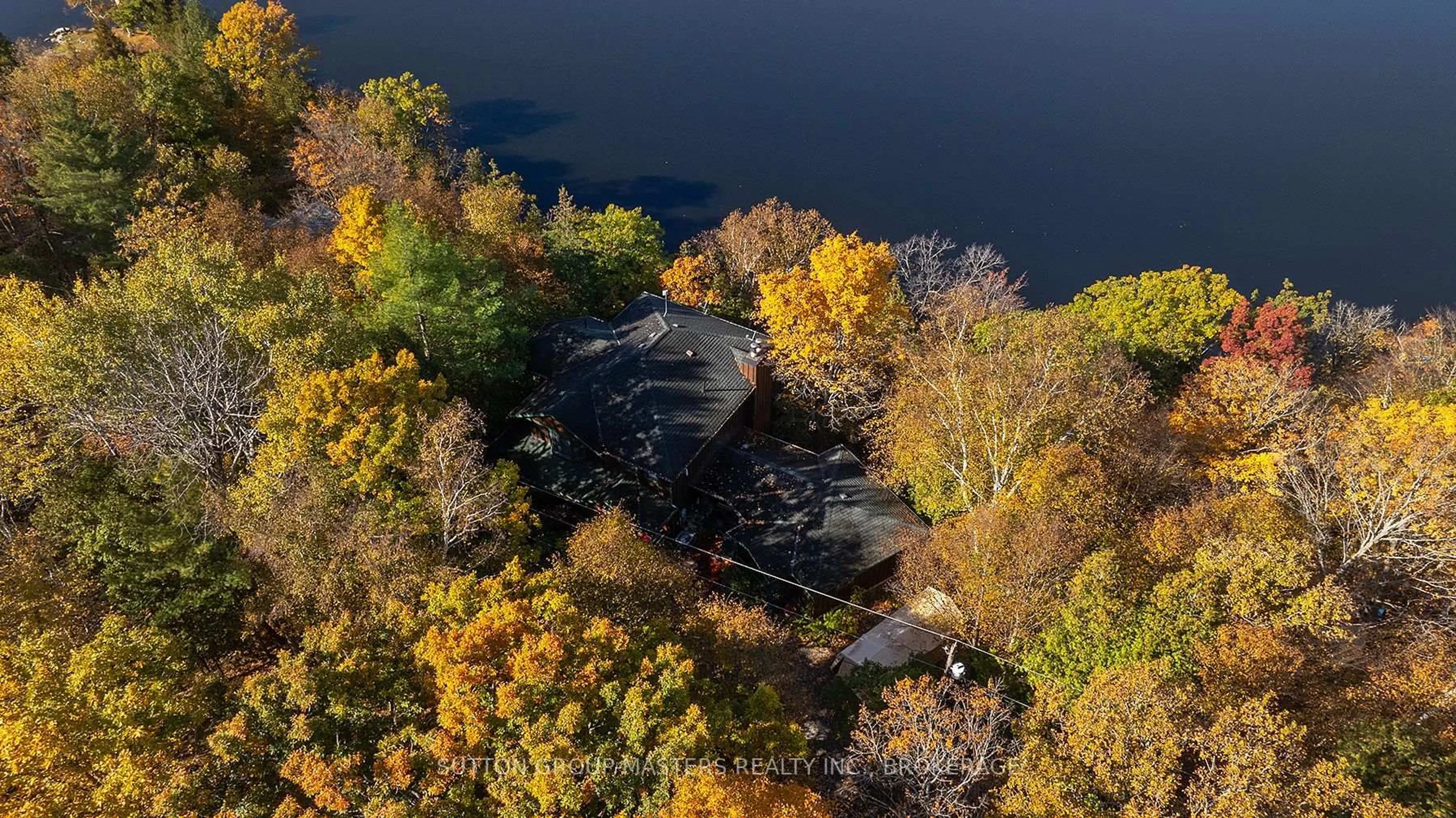 A pic from outside/outdoor area/front of a property/back of a property/a pic from drone, water/lake/river/ocean view for 1130 Storms Lane, Hartington Ontario K0H 1W0