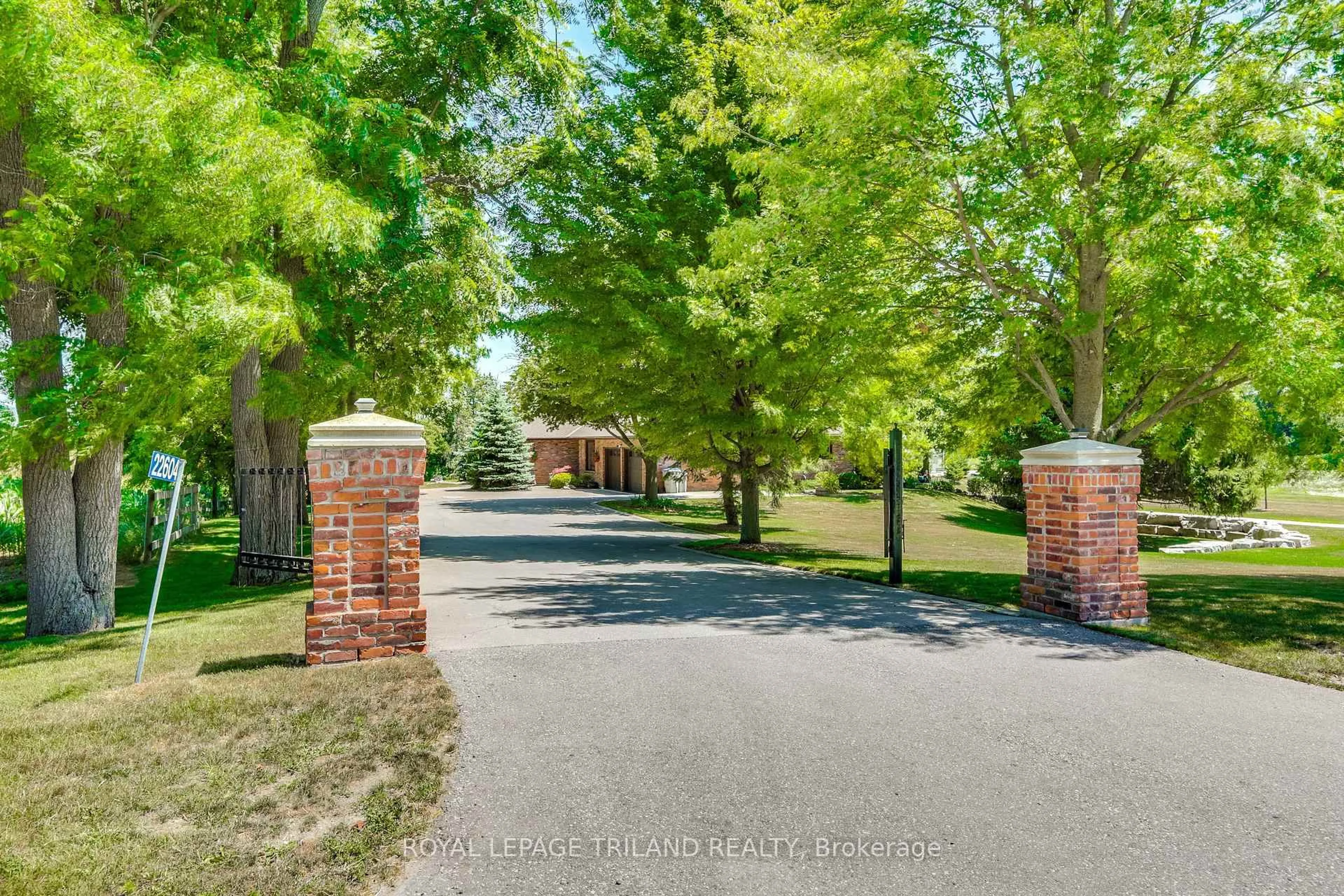 A pic from outside/outdoor area/front of a property/back of a property/a pic from drone, street for 22604 Vanneck Rd, Middlesex Centre Ontario N0M 2A0