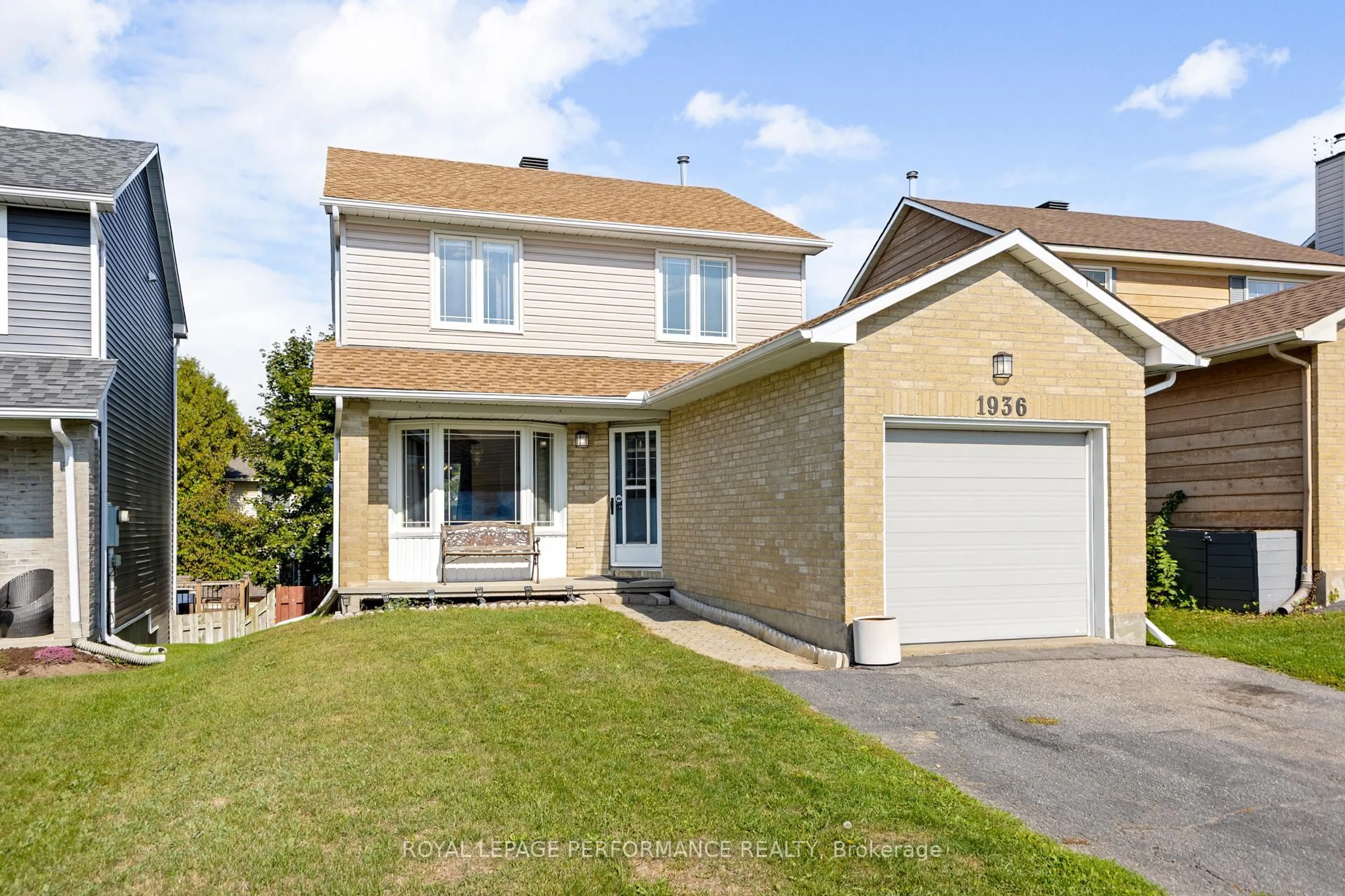 Home with vinyl exterior material, street for 1936 Longman Cres, Orleans Ontario K1C 5G6