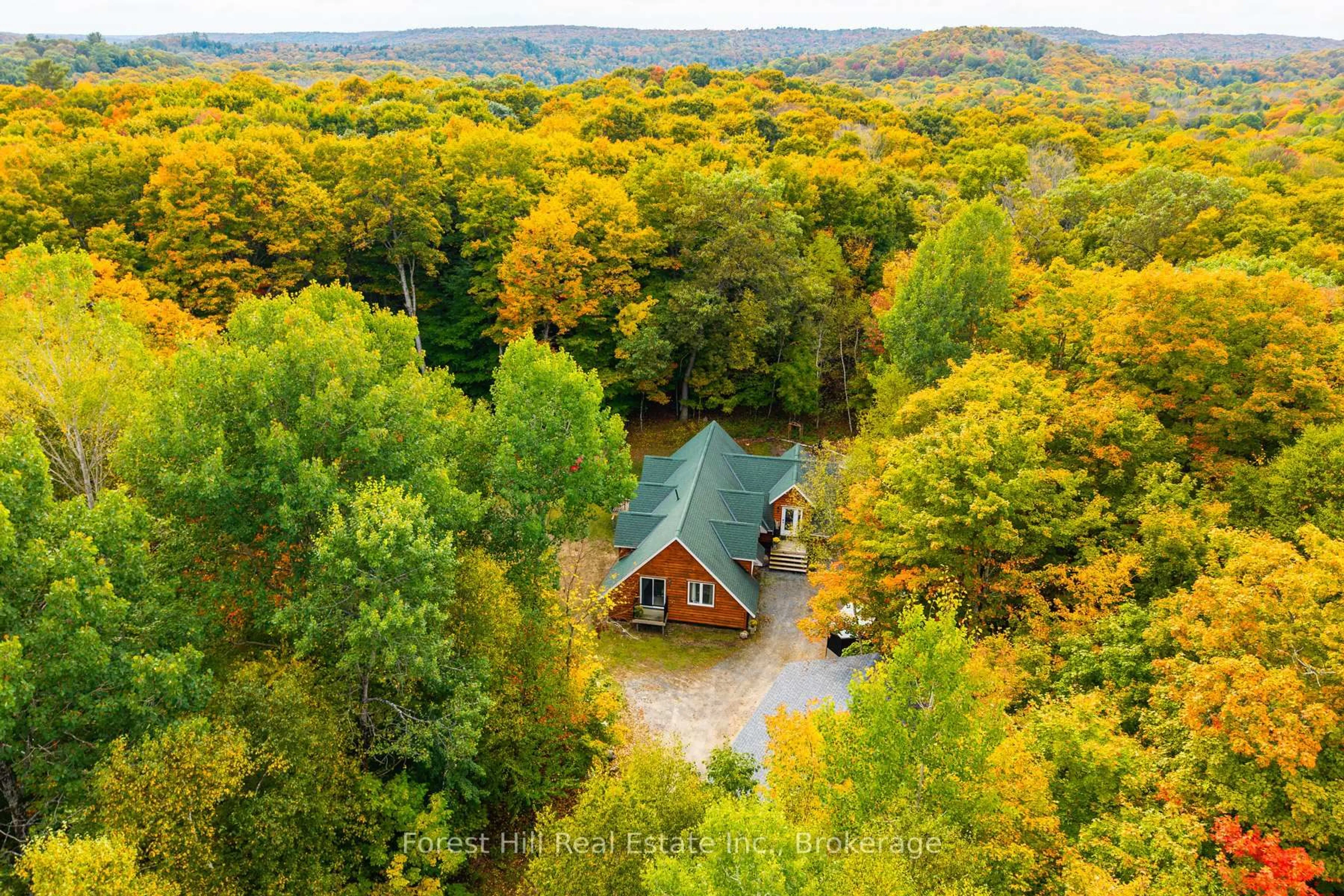 A pic from outside/outdoor area/front of a property/back of a property/a pic from drone, forest/trees view for 248 Vernon Shores Ave, Huntsville Ontario P1H 2J2