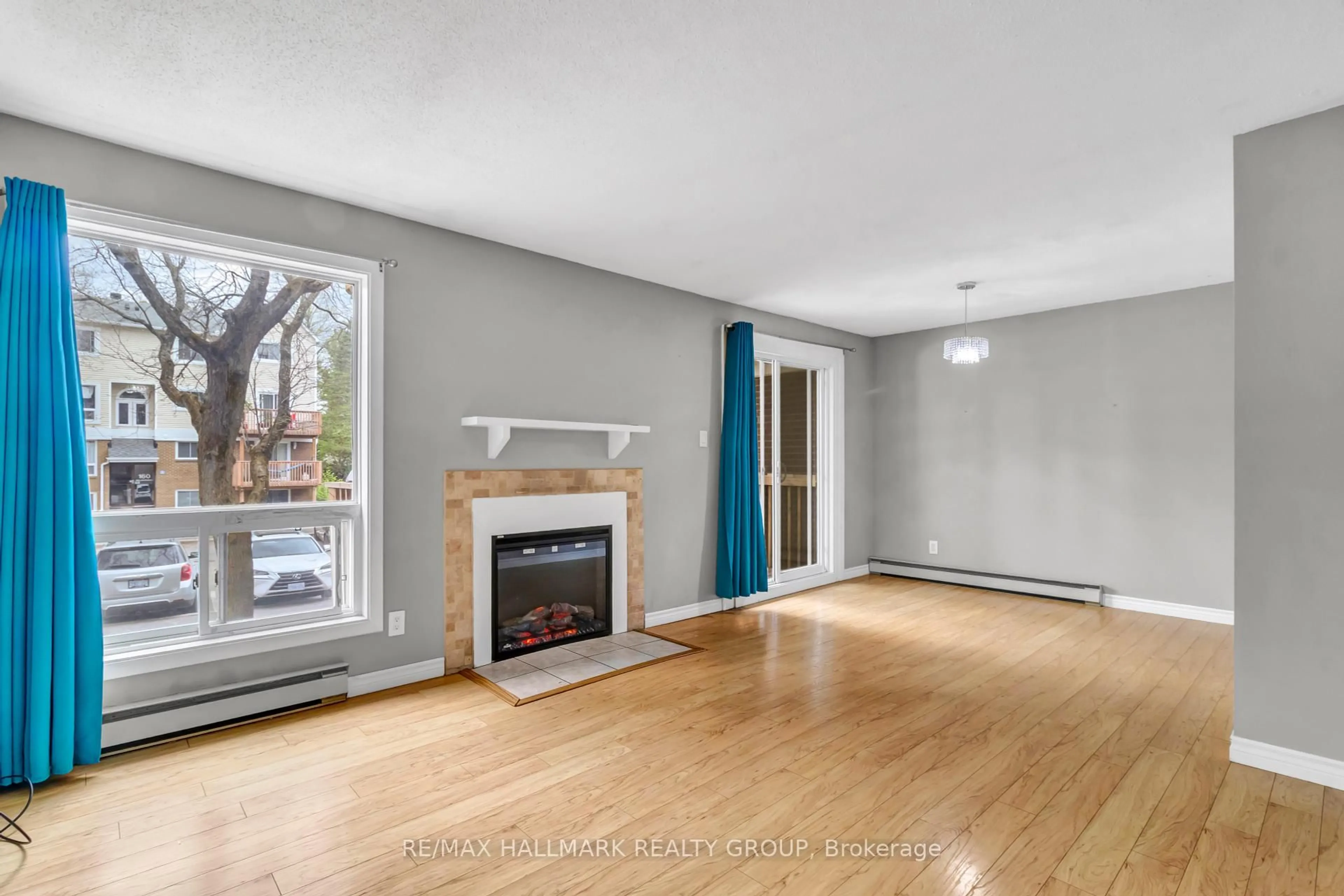 Living room with furniture, wood/laminate floor for 460 Fenerty Crt #1, Kanata Ontario K2L 3A9
