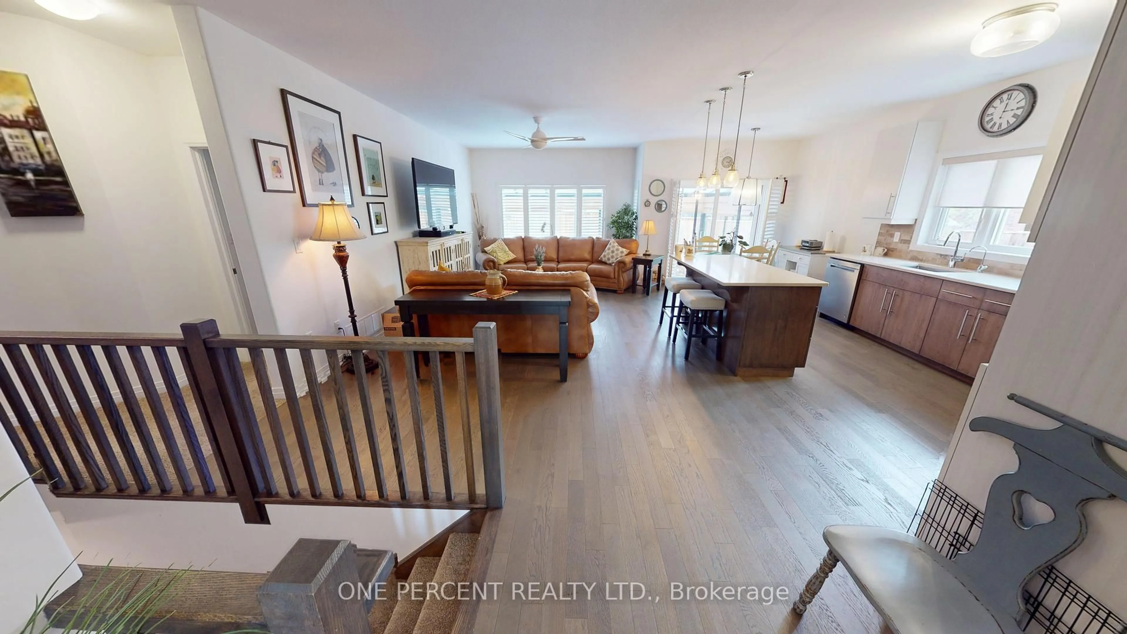 Living room with furniture, wood/laminate floor for 5064 Connor Dr, Lincoln Ontario L3J 0S1