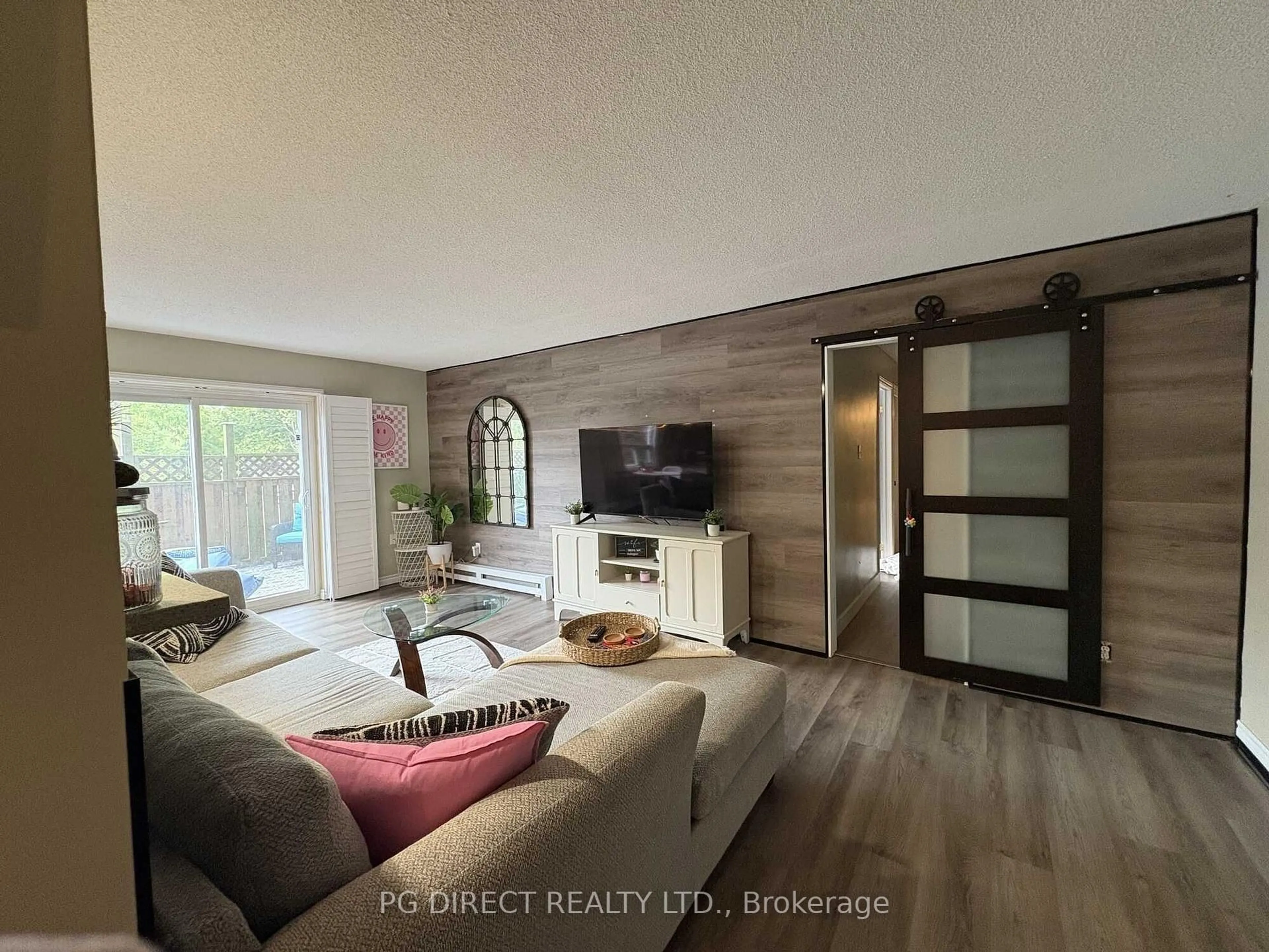 Living room with furniture, wood/laminate floor for 616 Grey St #15, Brantford Ontario N3S 4T3