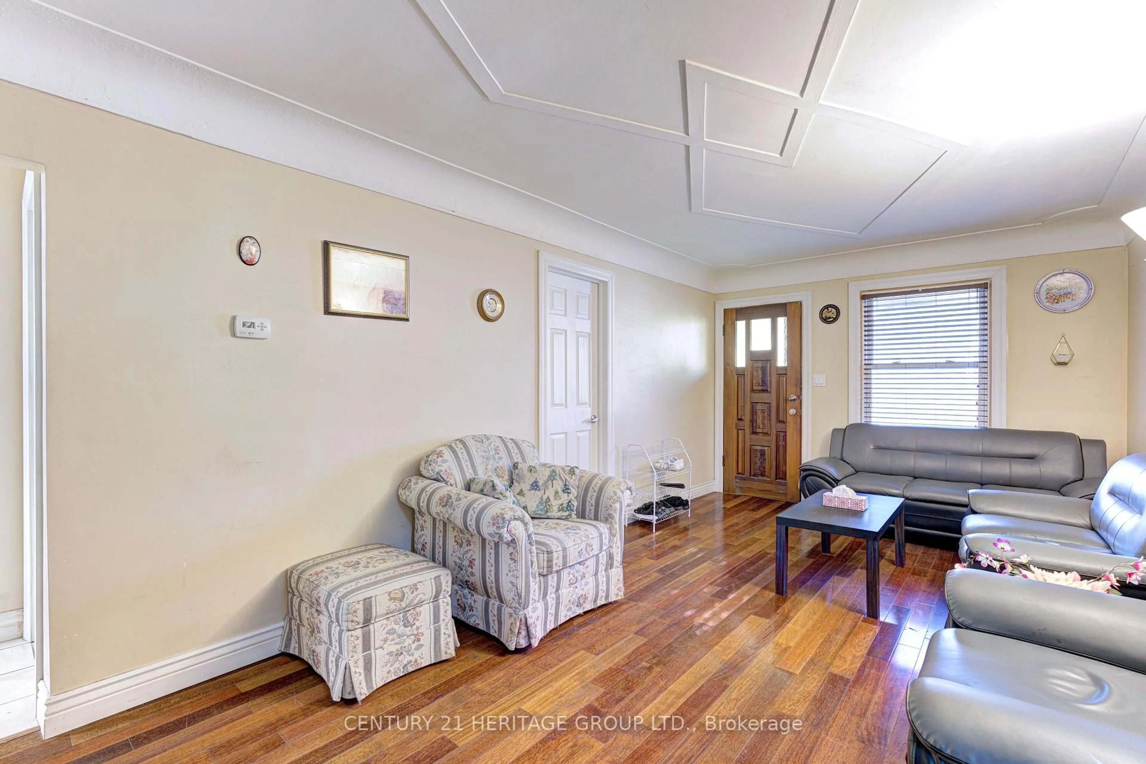 Living room with furniture, wood/laminate floor for 13 Cameron Ave, Hamilton Ontario L8H 4Y9
