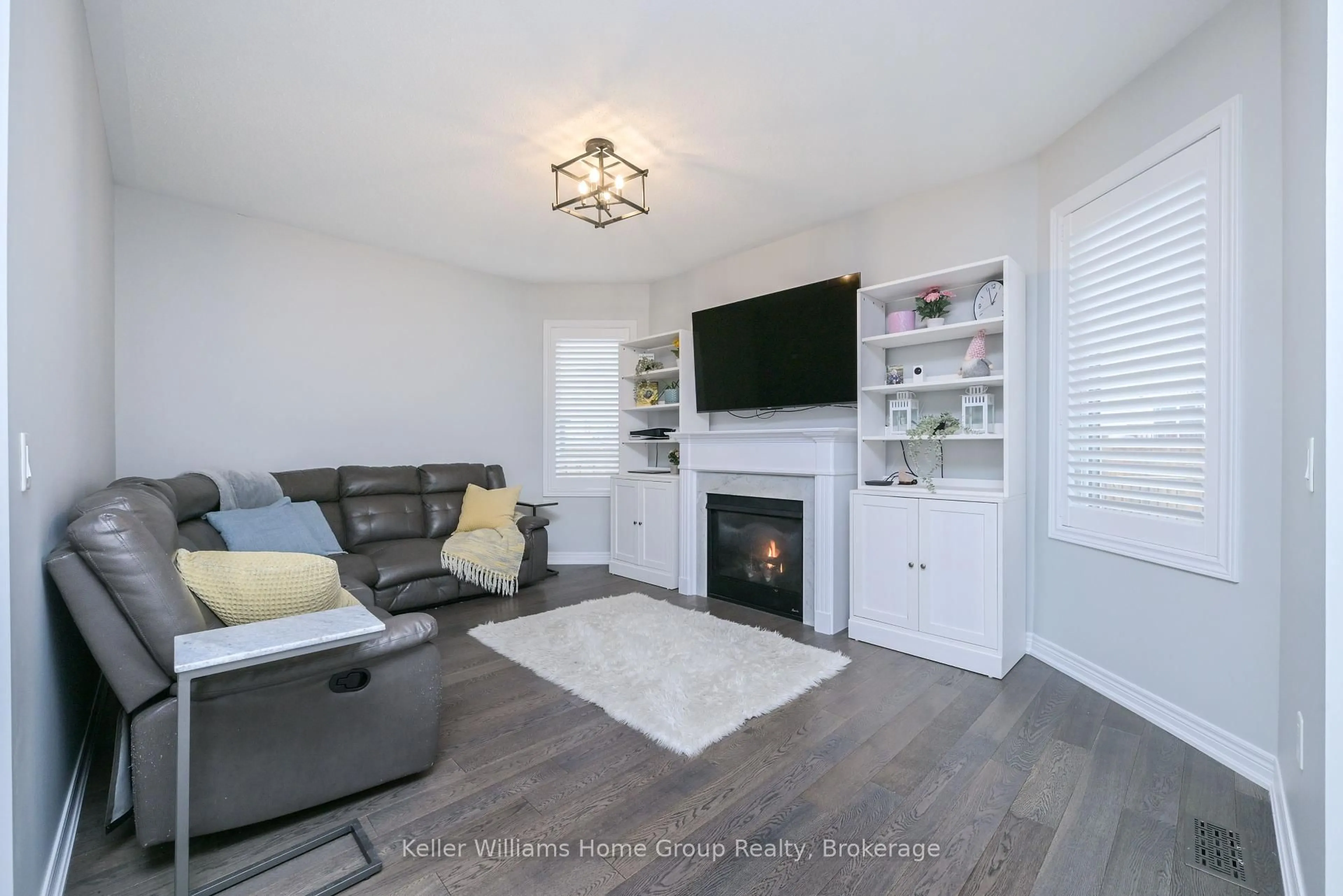 Living room with furniture, wood/laminate floor for 656 Armstrong Rd, Shelburne Ontario L9V 3V4