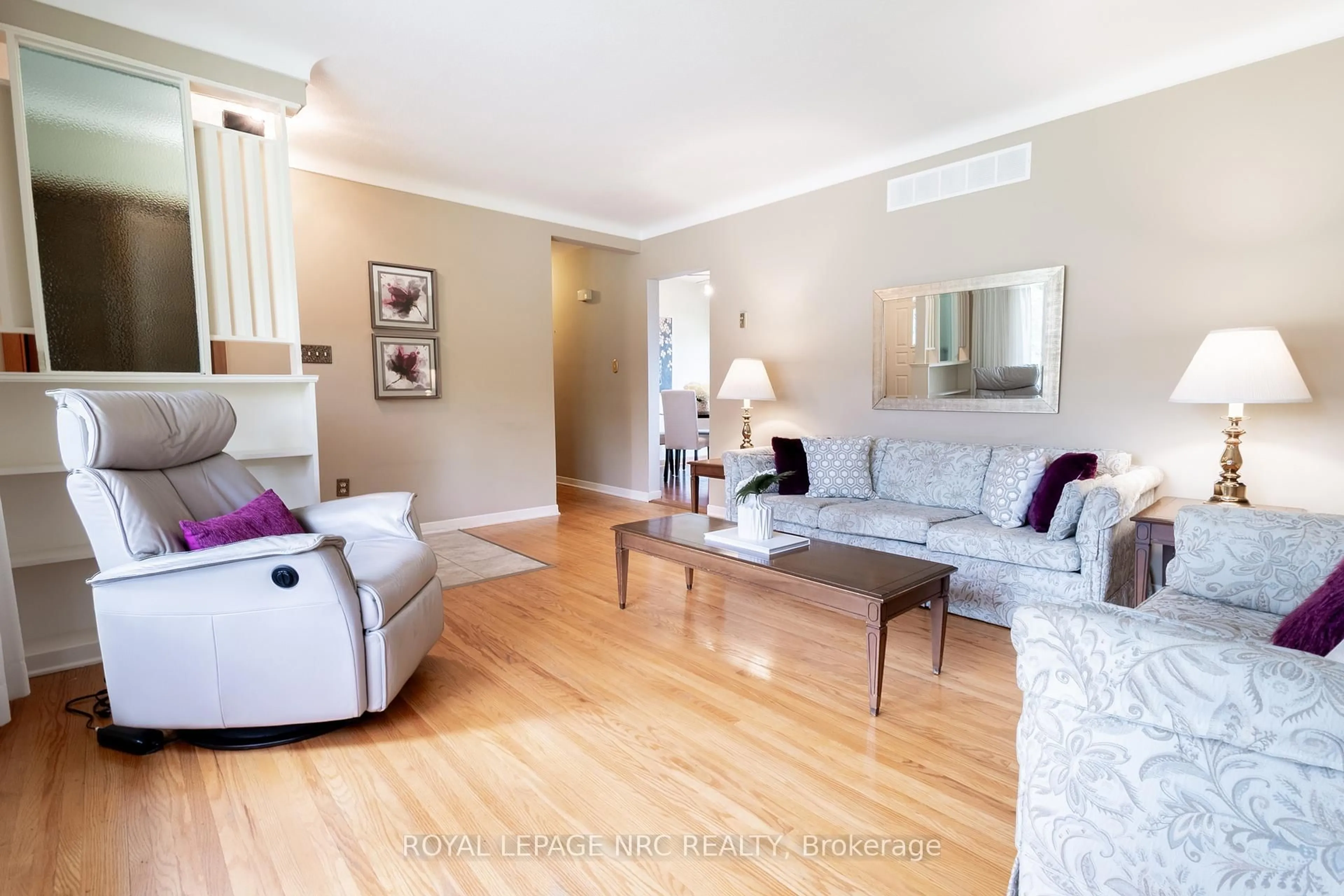 Living room with furniture, wood/laminate floor for 15 Monique Cres, St. Catharines Ontario L2M 1S8
