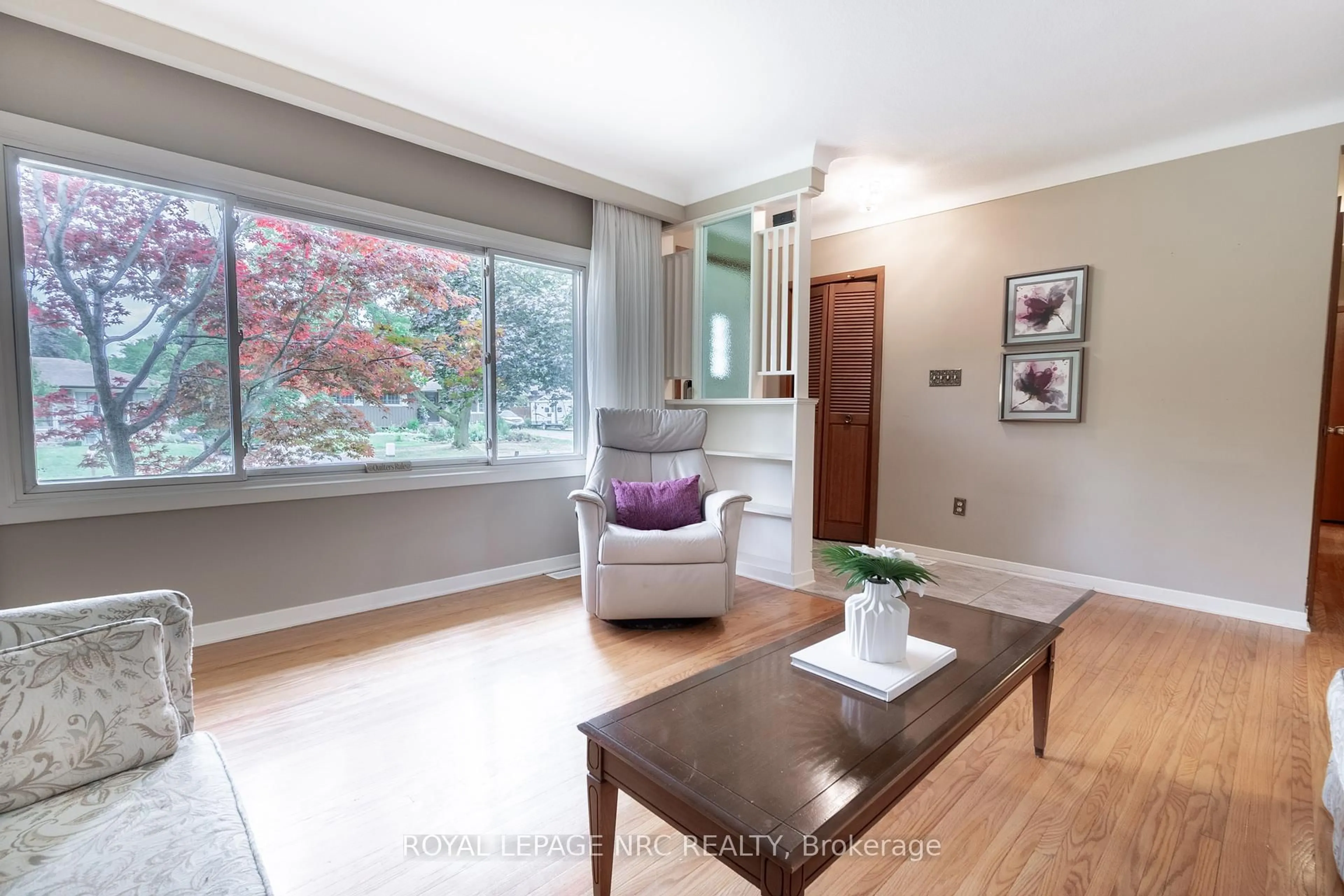Living room with furniture, wood/laminate floor for 15 Monique Cres, St. Catharines Ontario L2M 1S8