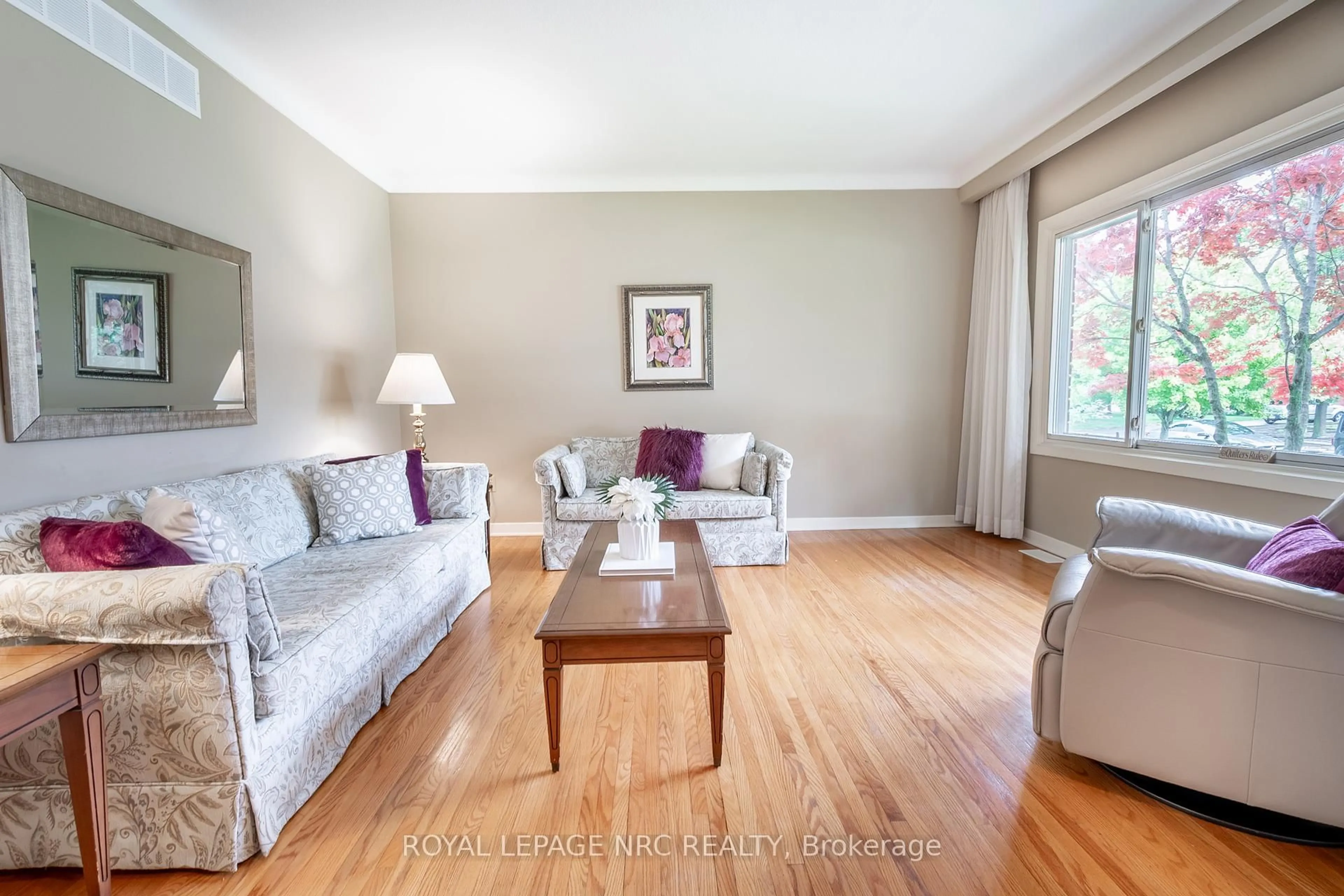 Living room with furniture, wood/laminate floor for 15 Monique Cres, St. Catharines Ontario L2M 1S8