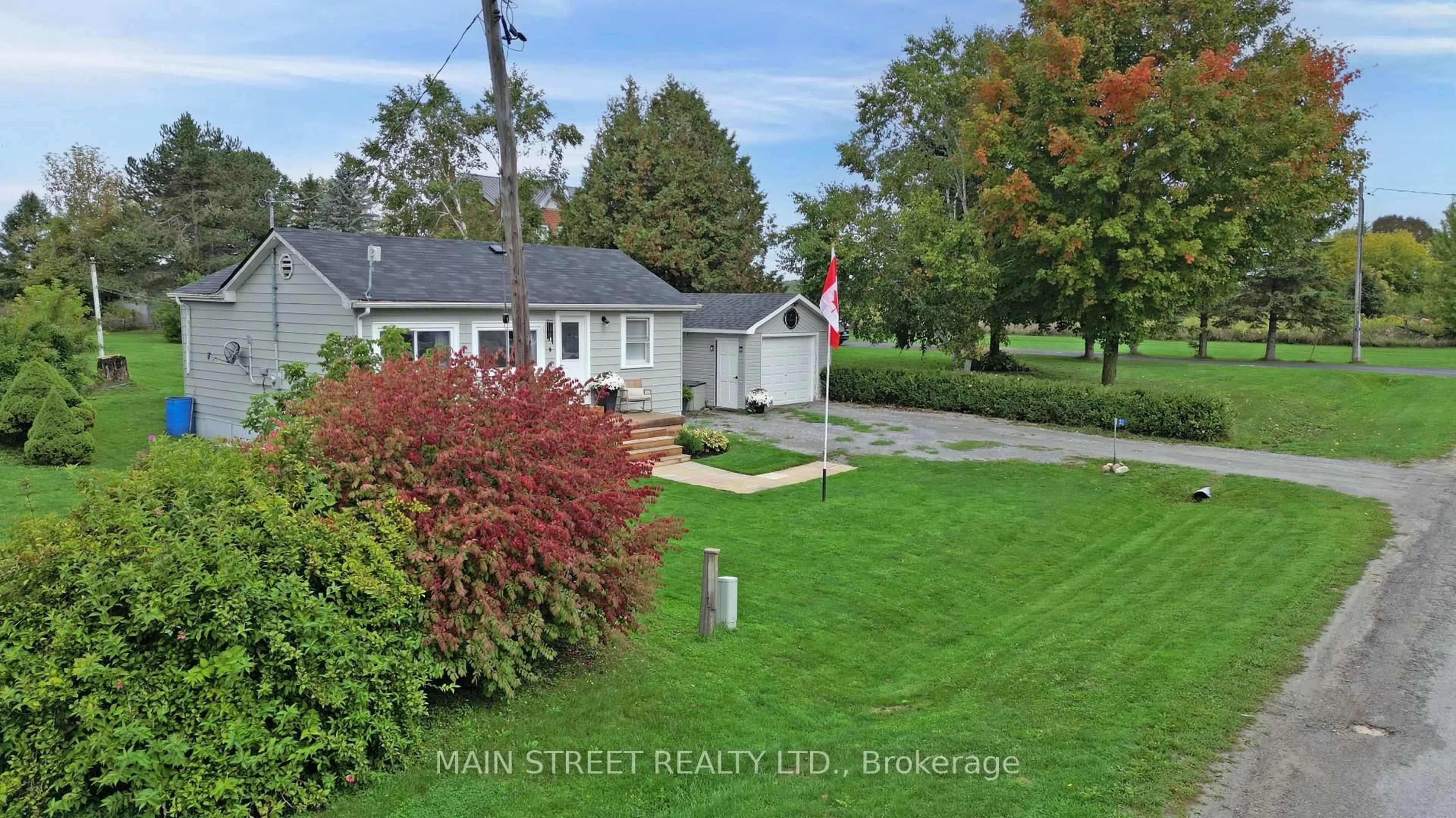 A pic from outside/outdoor area/front of a property/back of a property/a pic from drone, street for 32 Rhodes Ave, Kawartha Lakes Ontario L0C 1G0