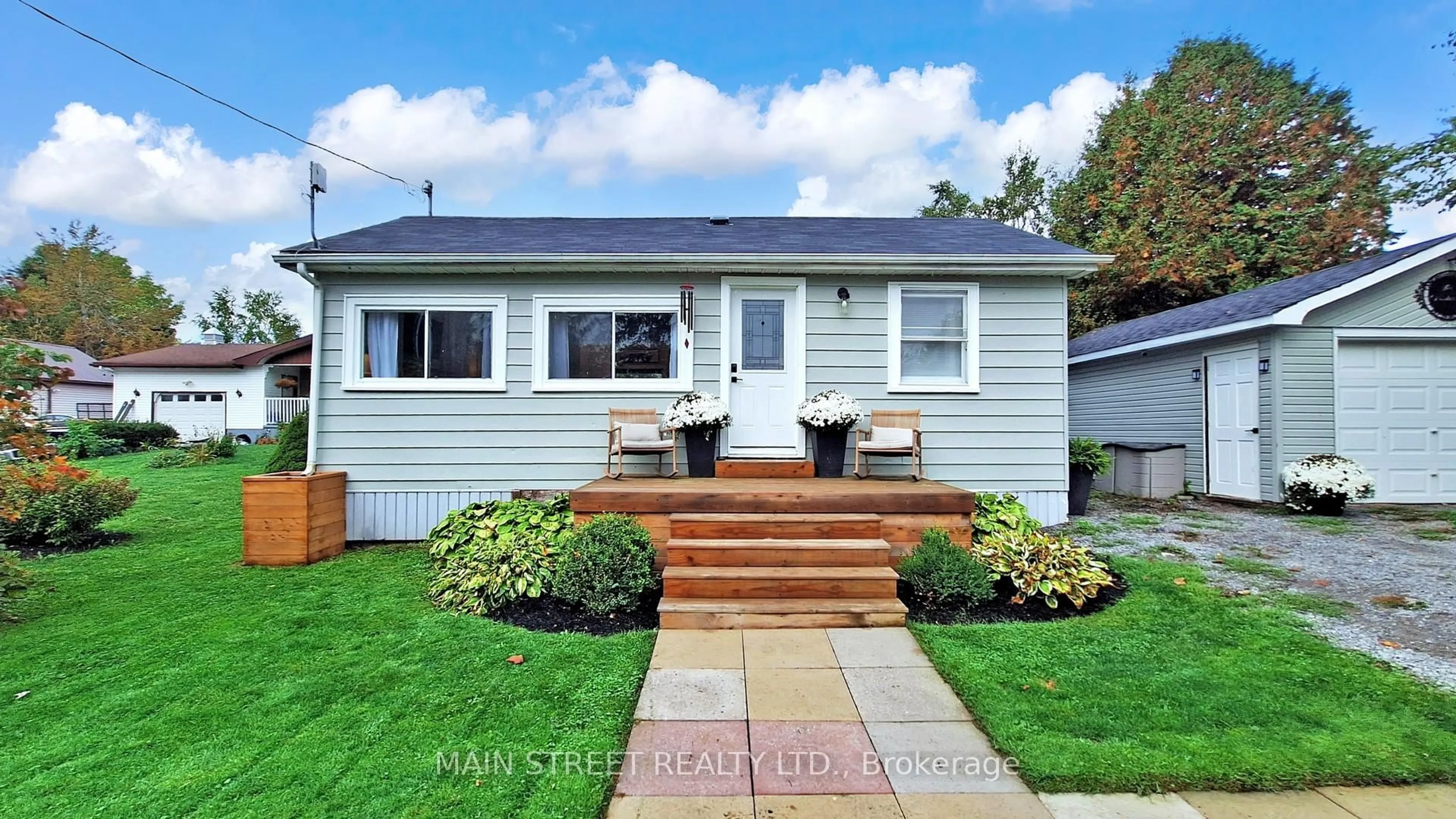 Home with vinyl exterior material, street for 32 Rhodes Ave, Kawartha Lakes Ontario L0C 1G0