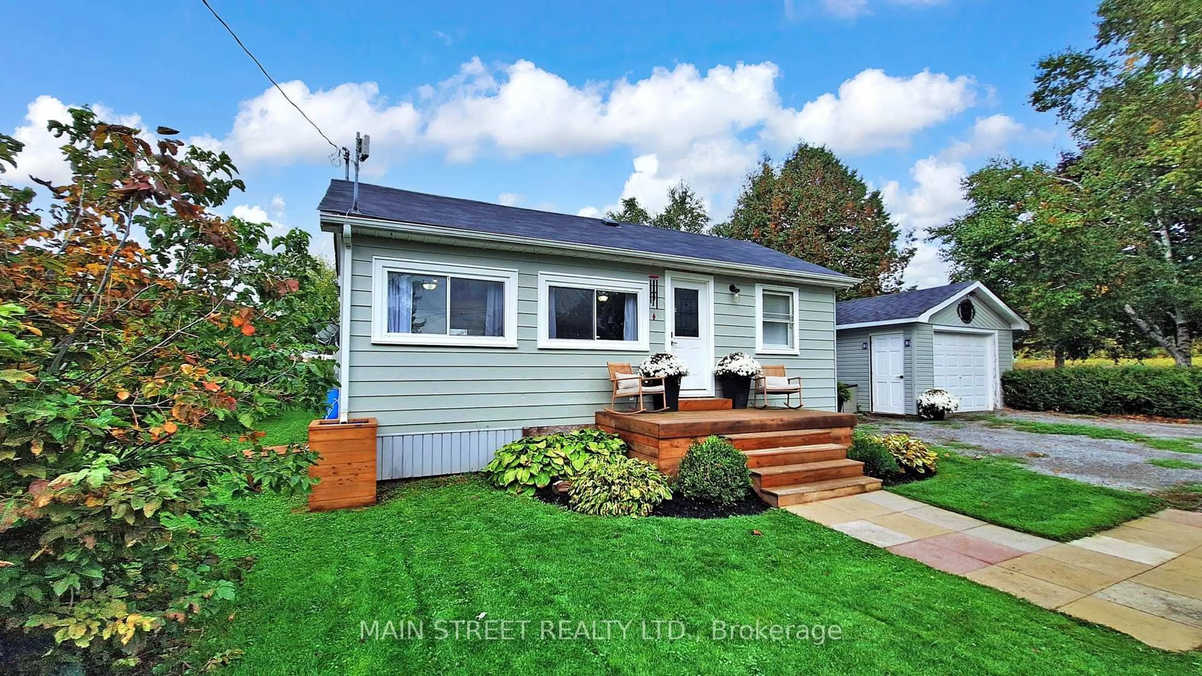 Home with vinyl exterior material, street for 32 Rhodes Ave, Kawartha Lakes Ontario L0C 1G0