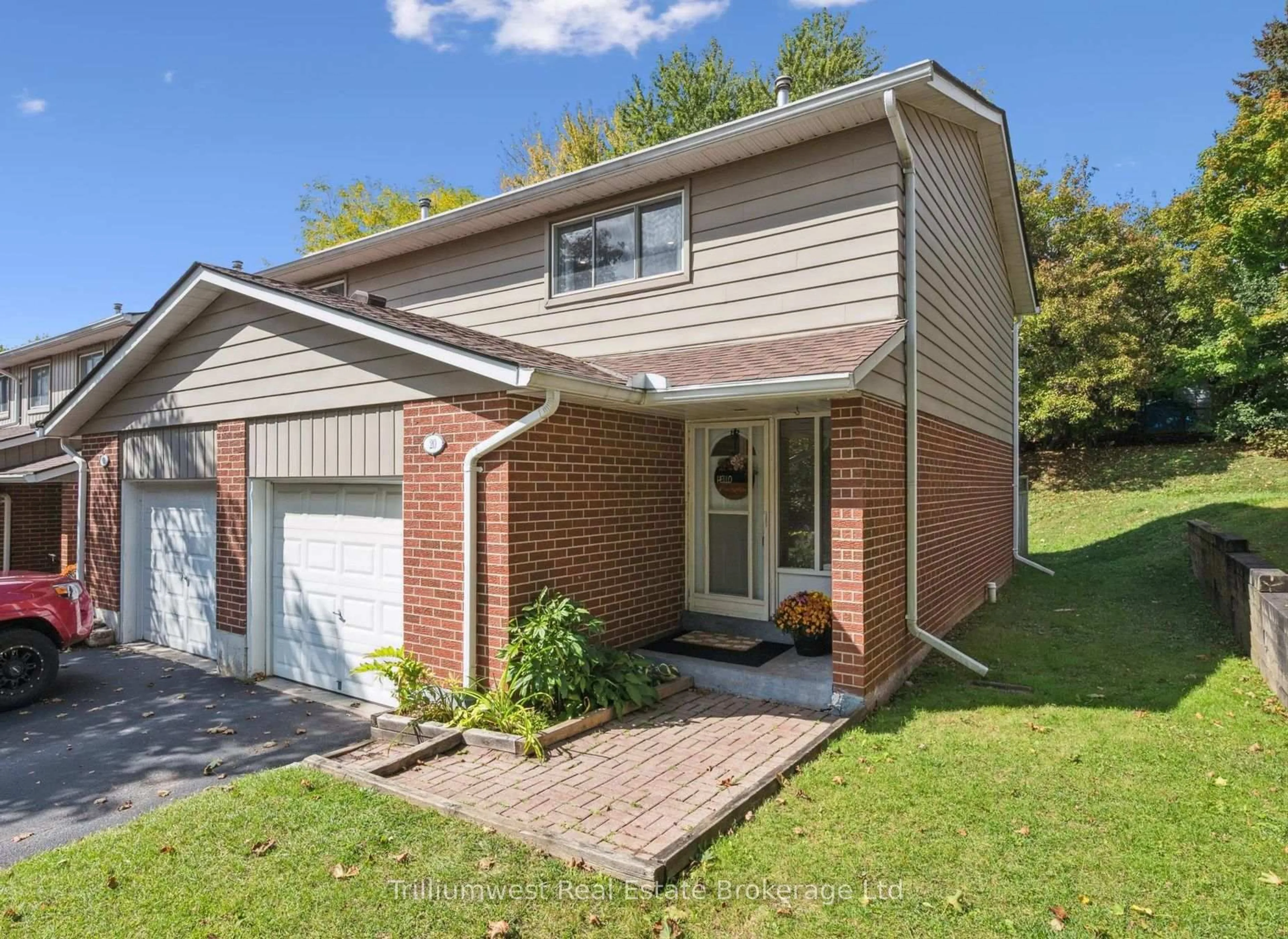 Home with brick exterior material, street for 16 Hadati Rd #20, Guelph Ontario N1E 6M2