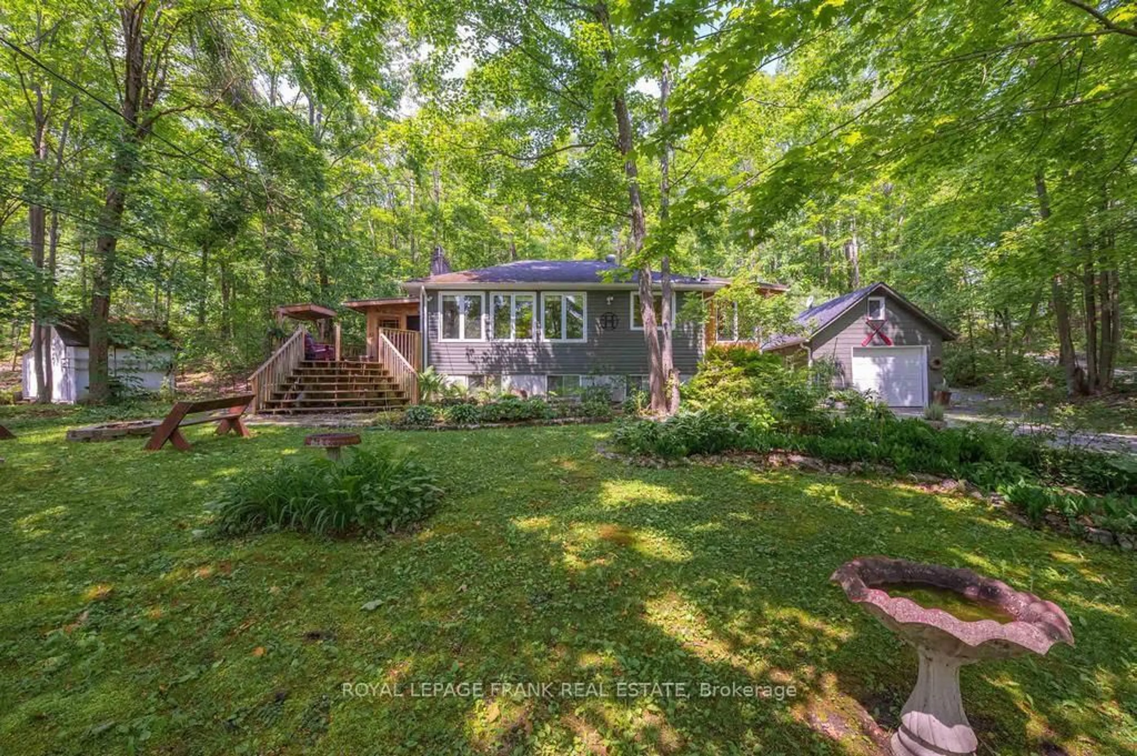 A pic from outside/outdoor area/front of a property/back of a property/a pic from drone, forest/trees view for 3 Fire Route 27B, Trent Lakes Ontario K0L 1J0