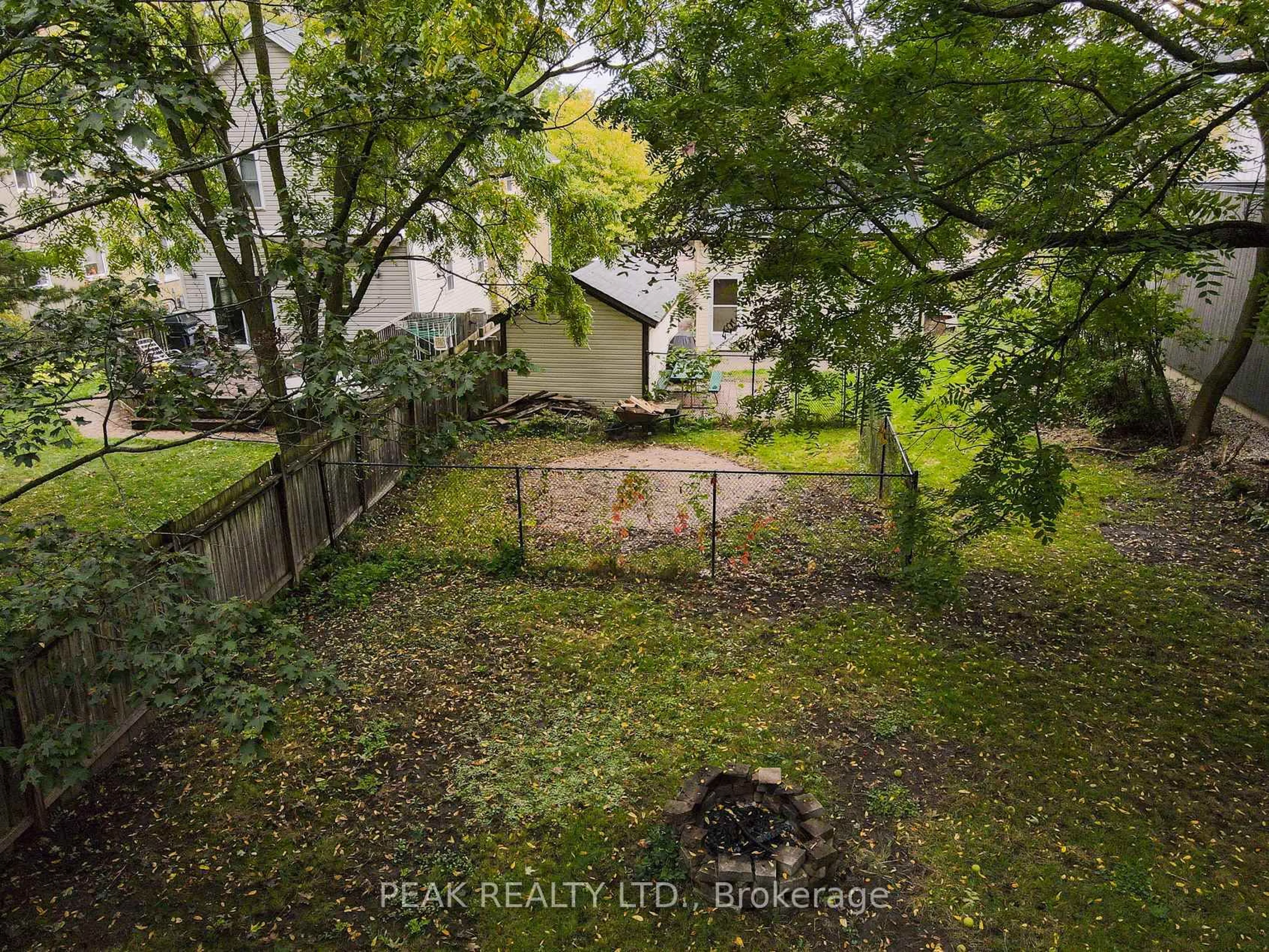 A pic from outside/outdoor area/front of a property/back of a property/a pic from drone, forest/trees view for 65 Short St, Waterloo Ontario N2L 1X9