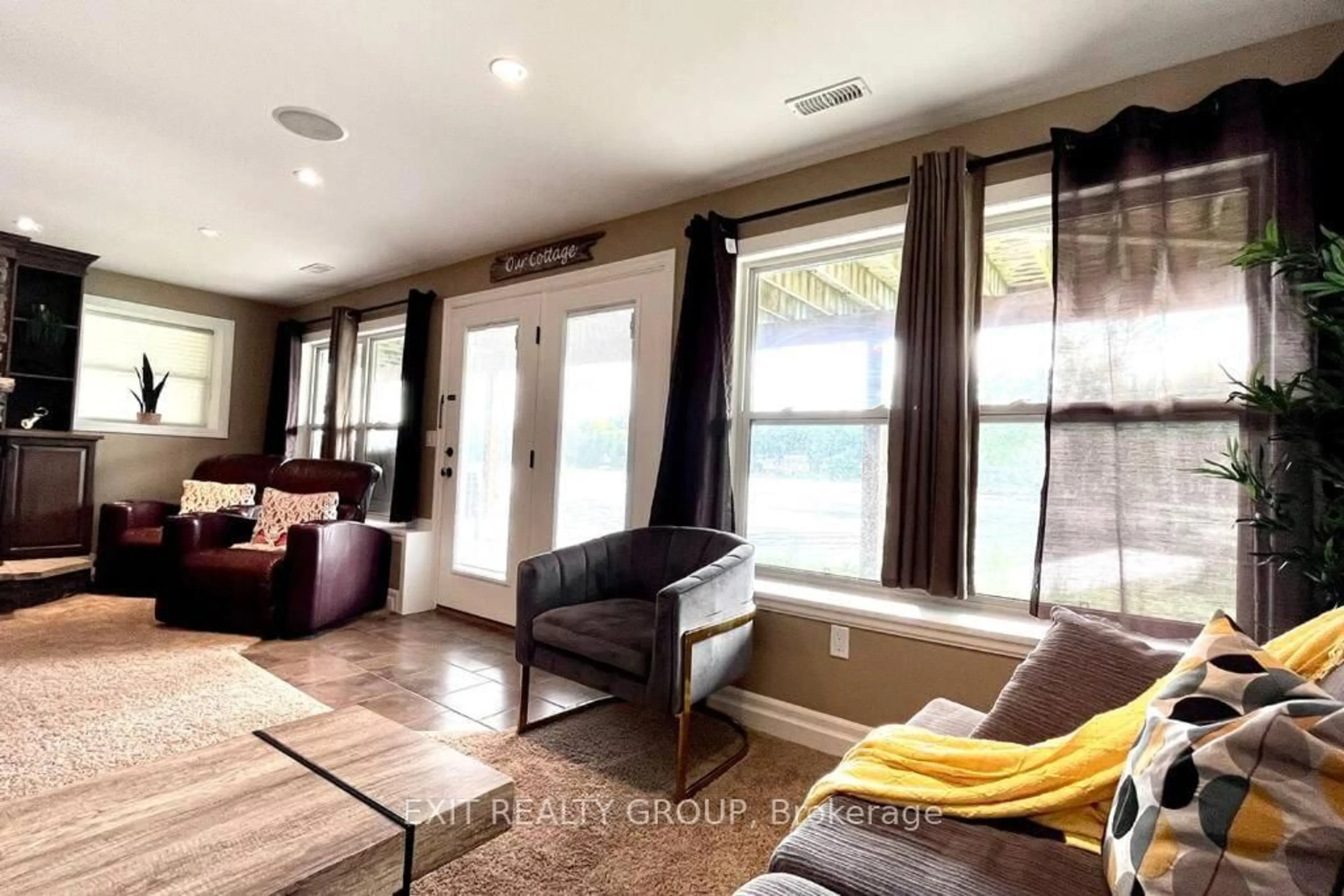 Living room with furniture, wood/laminate floor for 1531 Foxboro Stirling Rd, Stirling Ontario K0K 3E0