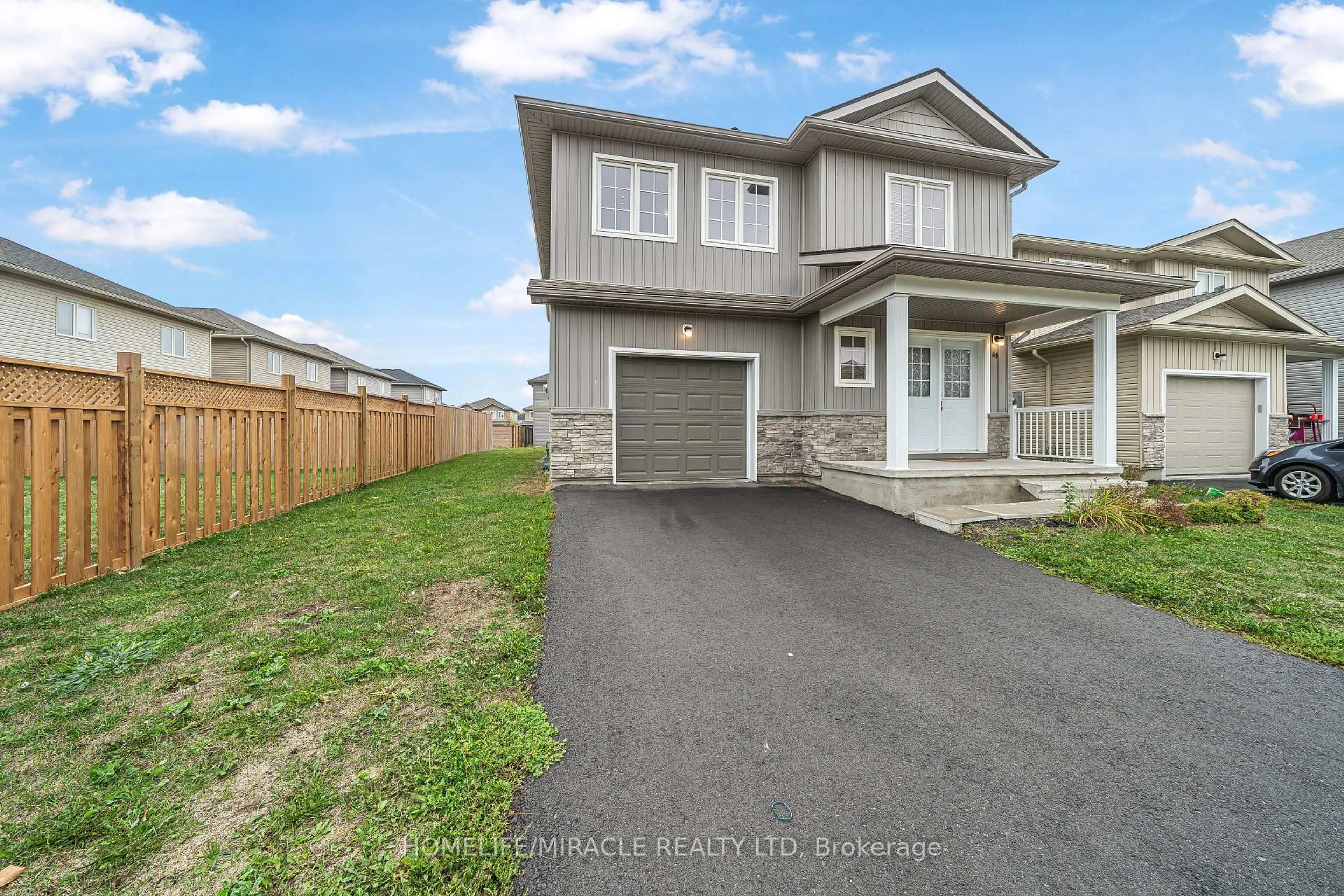 A pic from outside/outdoor area/front of a property/back of a property/a pic from drone, street for 63 Brennan Cres, Bissett Creek Ontario K0H 2H0