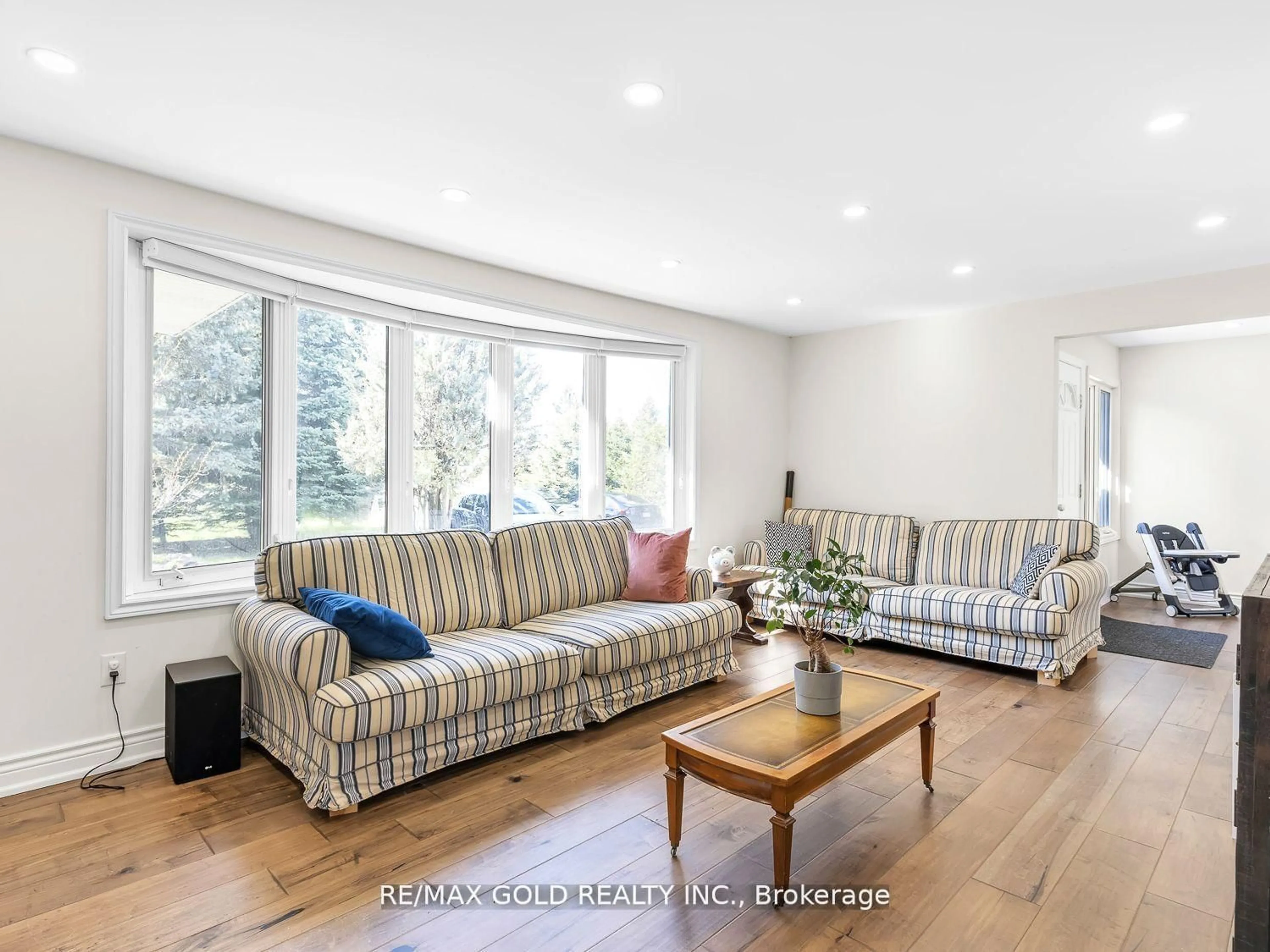 Living room with furniture, wood/laminate floor for 8017 Highway 7, Guelph/Eramosa Ontario N1H 6H8