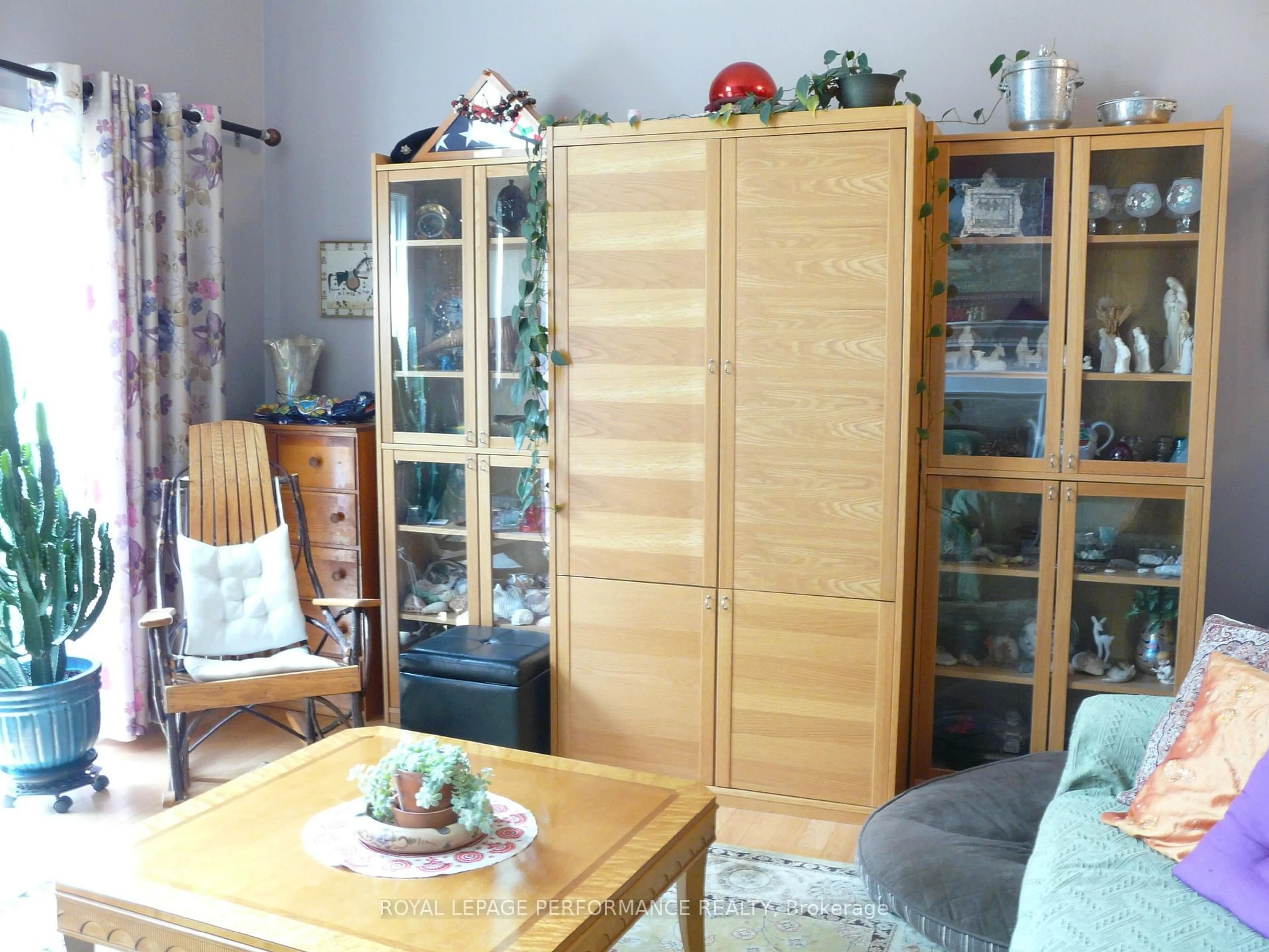 Living room with furniture, wood/laminate floor for 1473 Waltham St, Ottawa Ontario K1T 2T5