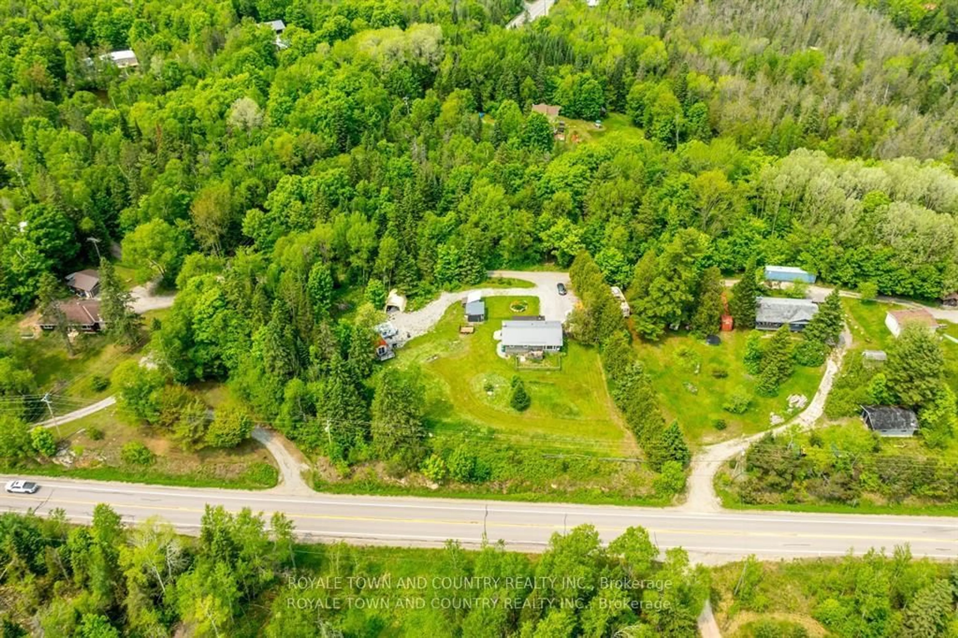 A pic from outside/outdoor area/front of a property/back of a property/a pic from drone, forest/trees view for 1042 Tweed Dr, Highlands East Ontario K0M 1R0