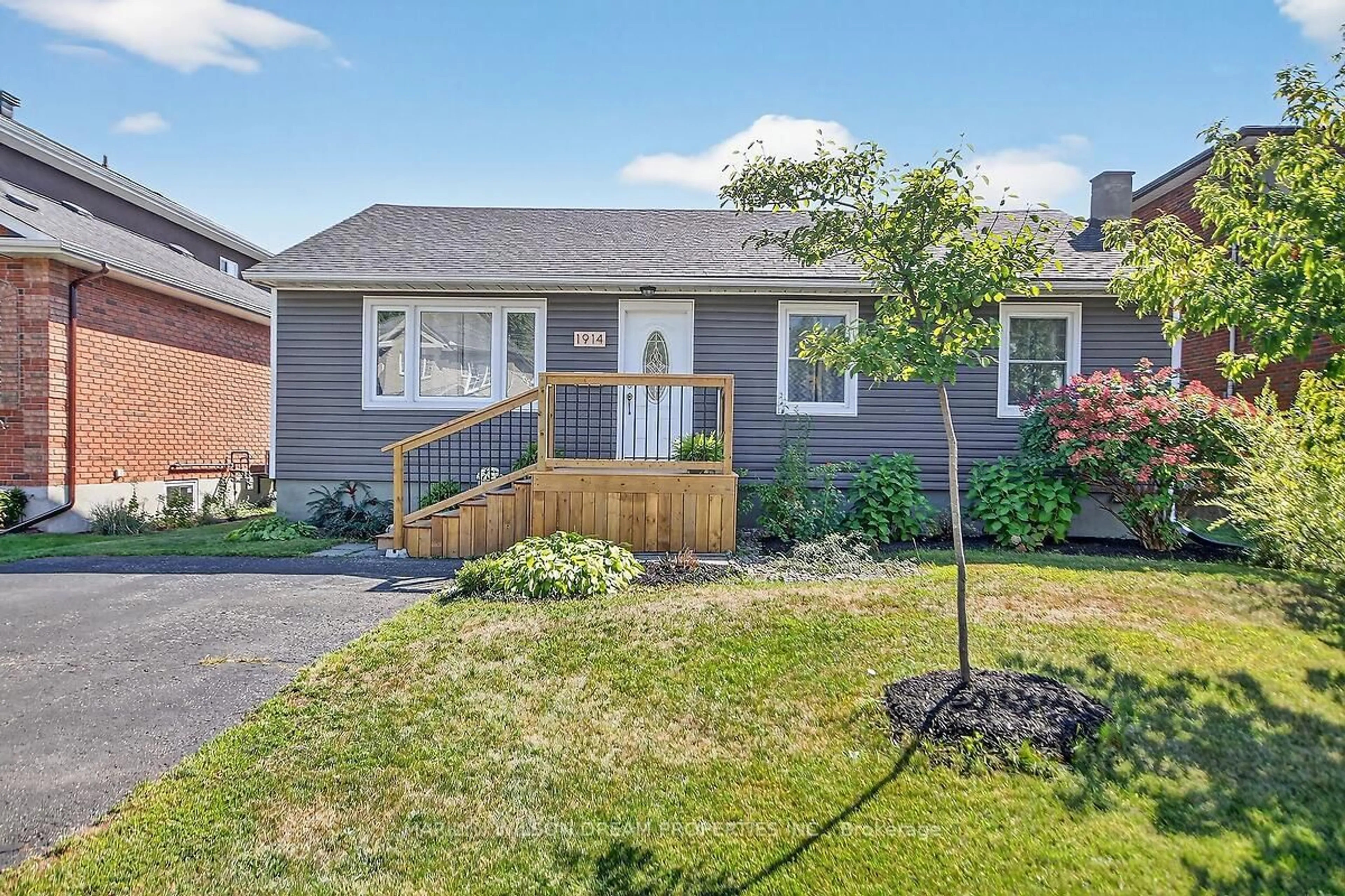 Home with vinyl exterior material, street for 1914 Rosebella Ave, Ottawa Ontario K1T 1G7