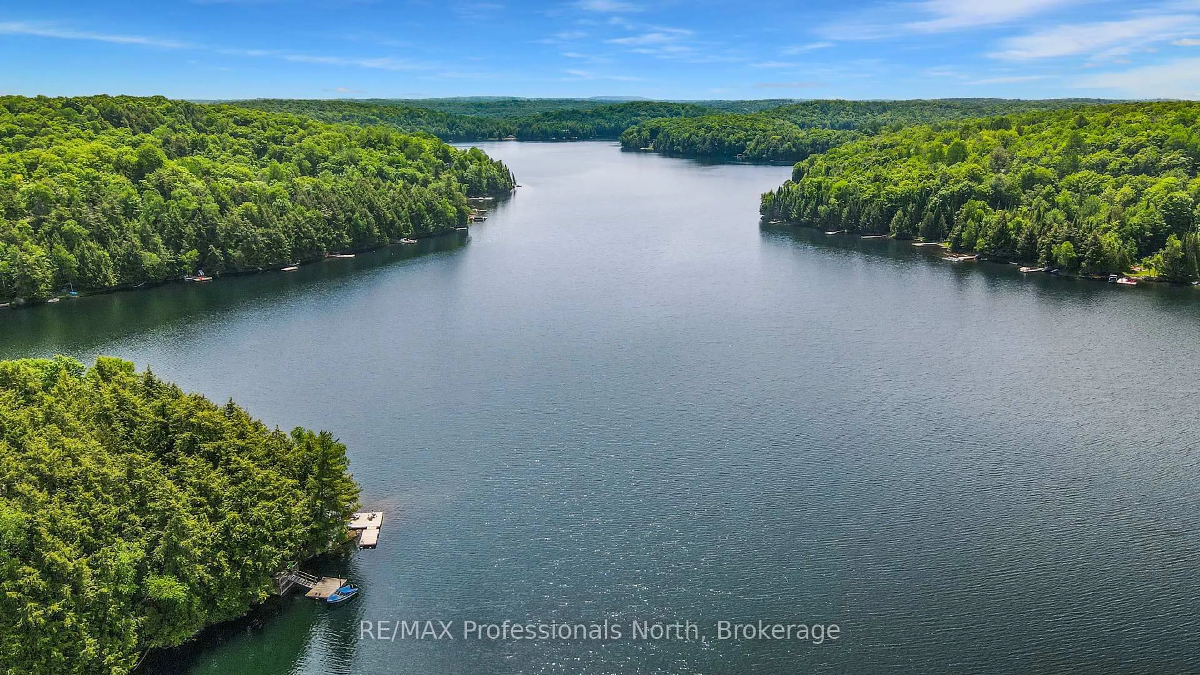 A pic from outside/outdoor area/front of a property/back of a property/a pic from drone, water/lake/river/ocean view for 1511 Wenona Lake Rd, Dysart et al Ontario K0M 1S0