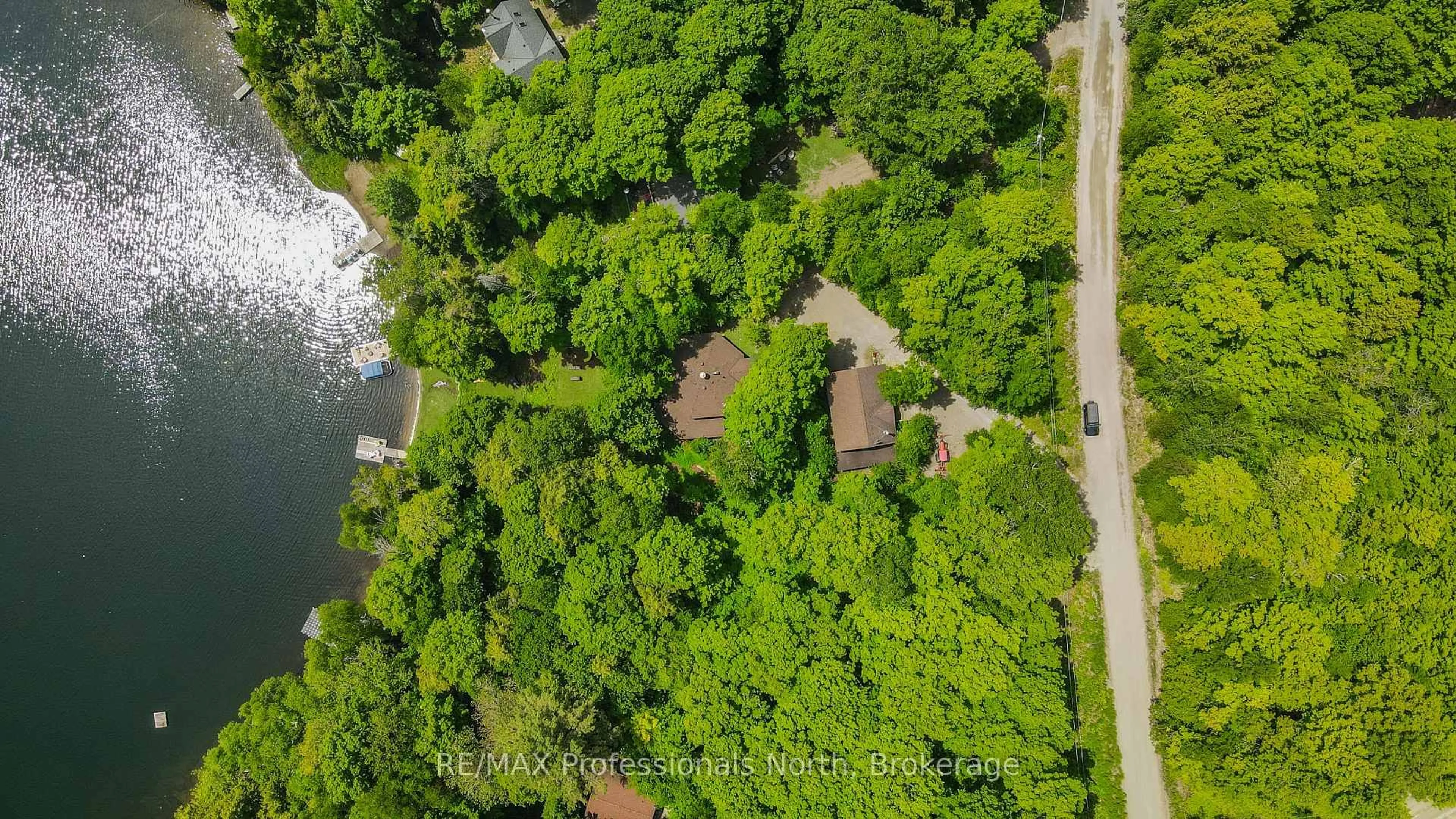 A pic from outside/outdoor area/front of a property/back of a property/a pic from drone, forest/trees view for 1511 Wenona Lake Rd, Dysart et al Ontario K0M 1S0