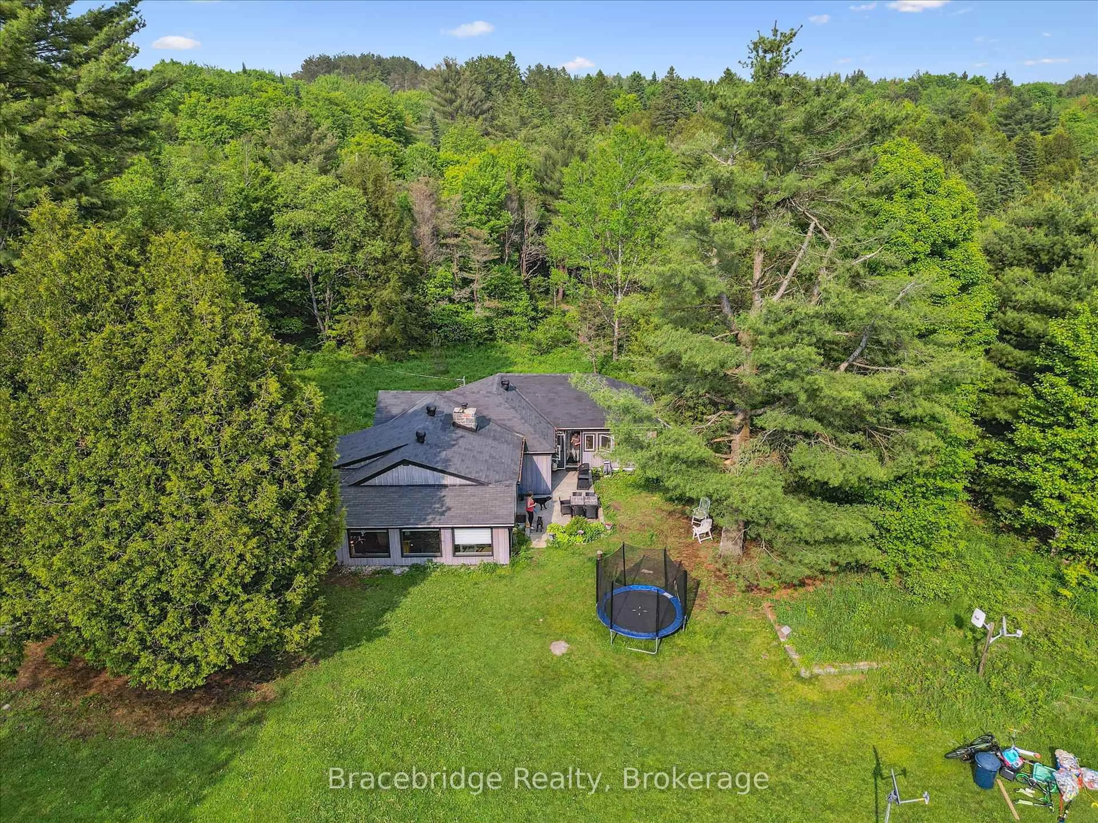 A pic from outside/outdoor area/front of a property/back of a property/a pic from drone, water/lake/river/ocean view for 1151 Beatrice Twn Line, Bracebridge Ontario P1L 1X4