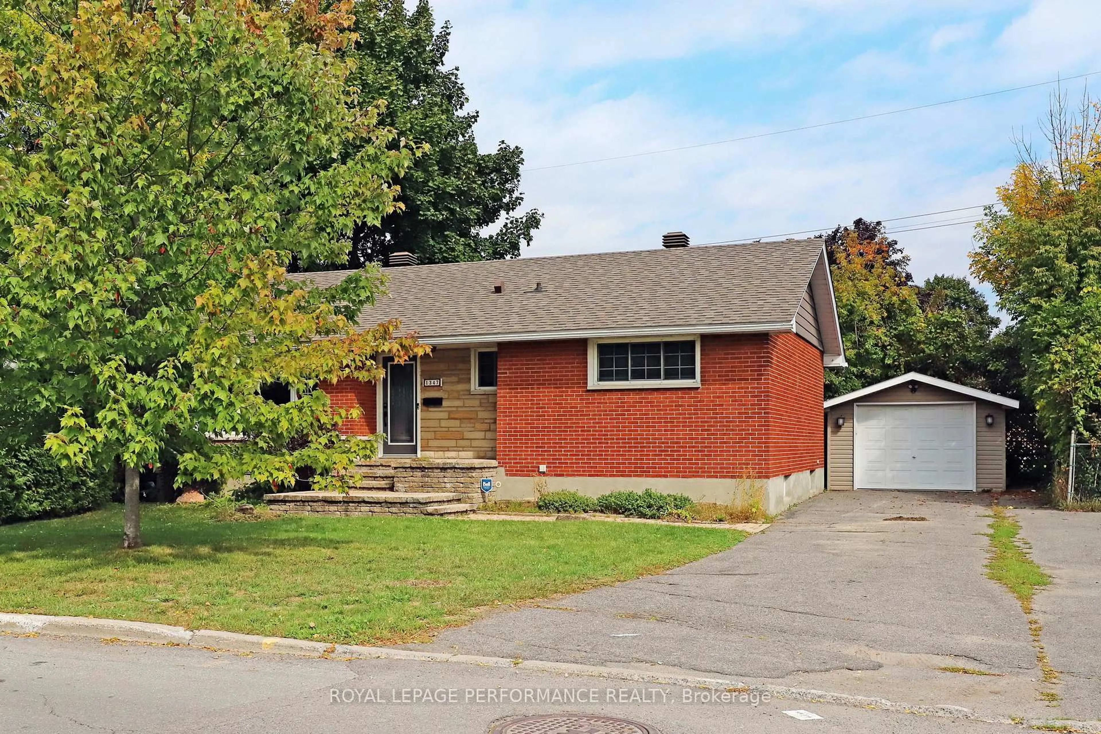 Home with brick exterior material, street for 1347 Highgate Rd, Ottawa Ontario K2C 2Y5
