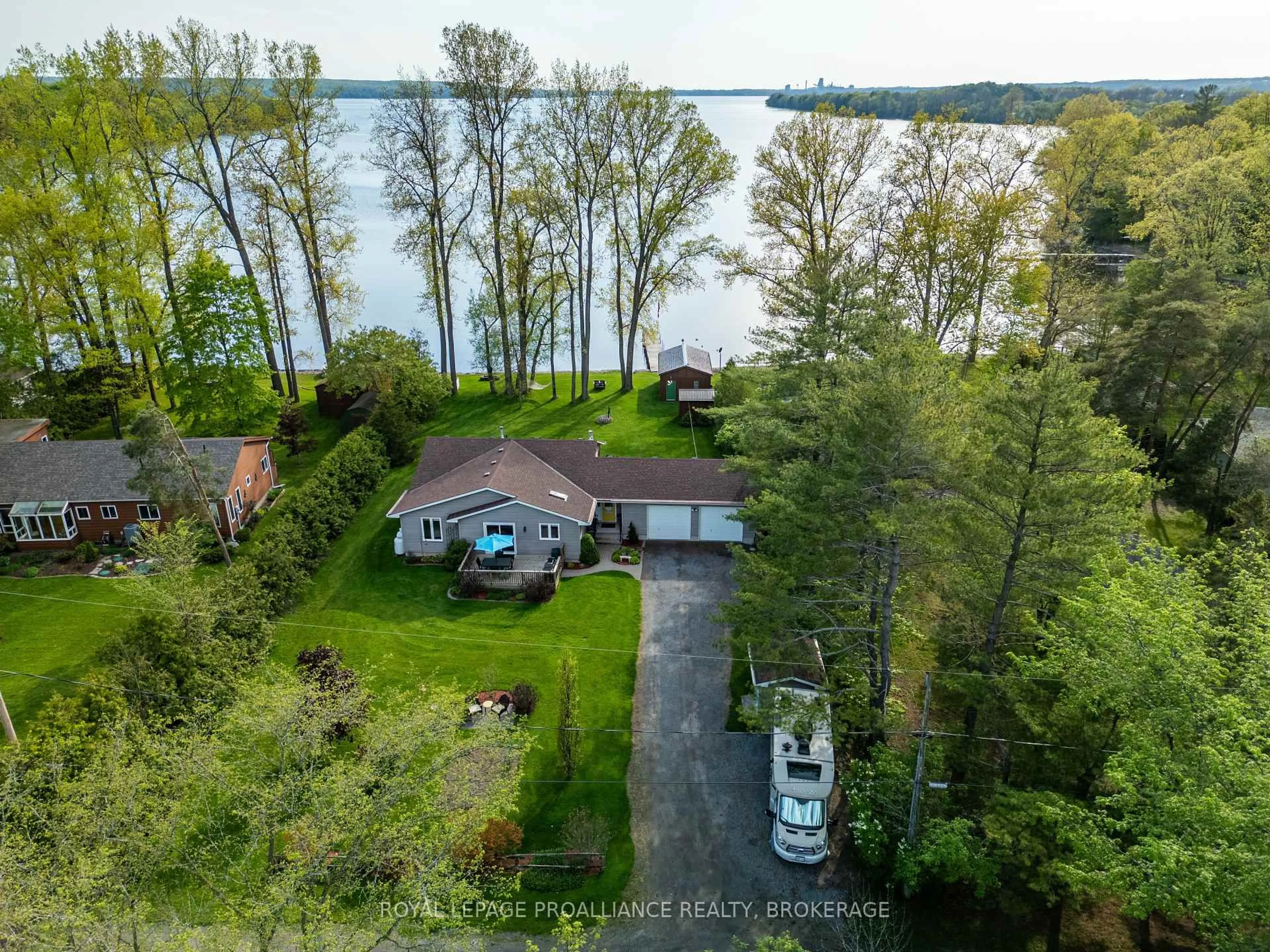 A pic from outside/outdoor area/front of a property/back of a property/a pic from drone, water/lake/river/ocean view for 14 Sunset Lane, Napanee Ontario K7R 3K7