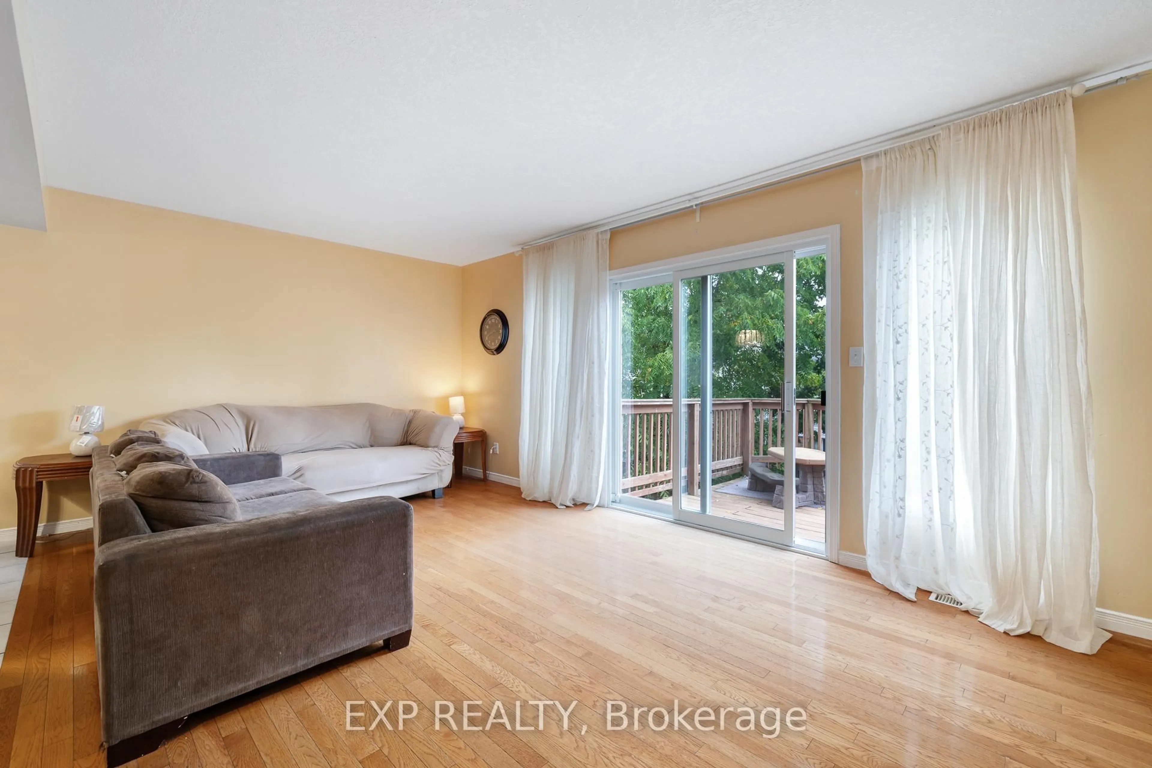 Living room with furniture, wood/laminate floor for 992 Copper Leaf Cres, Kitchener Ontario N2E 3W3